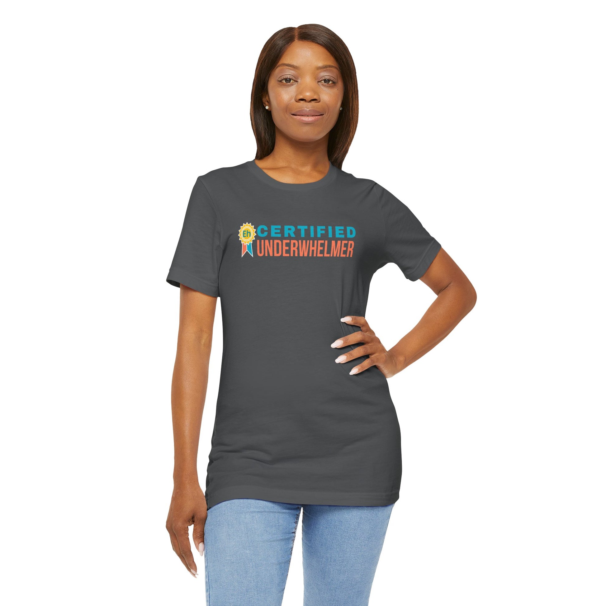 Woman wearing a gray t-shirt with 'Certified Underwhelmer' text on a white background