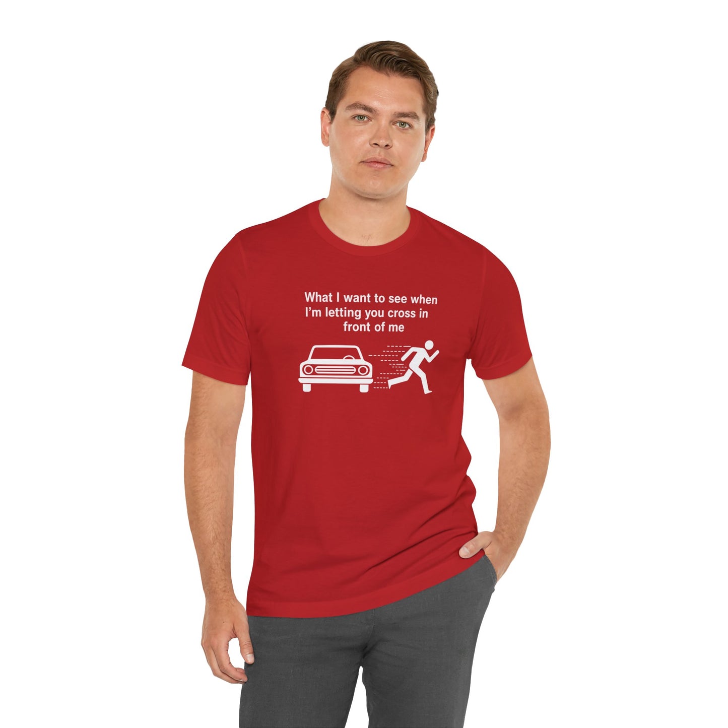 Man wearing a red t-shirt with a humorous graphic and text 'What I want to see when I'm letting you cross in front of me' on a white background