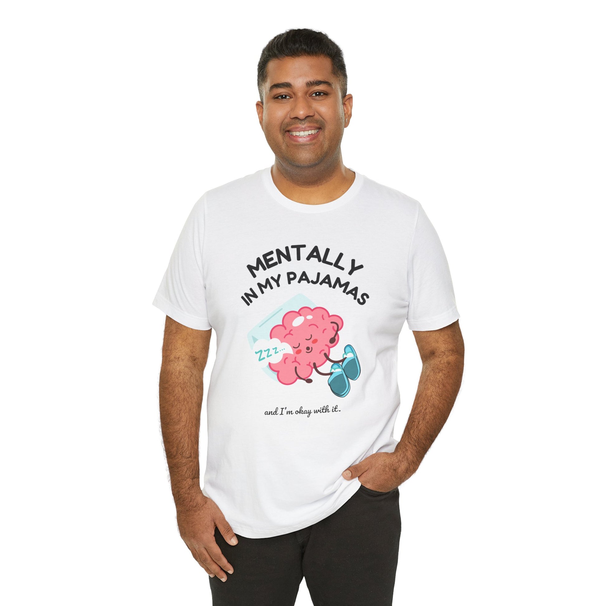 Man wearing a white t-shirt with a cartoon character and text 'Mentally in my pajamas and I'm ok with it' on a white background