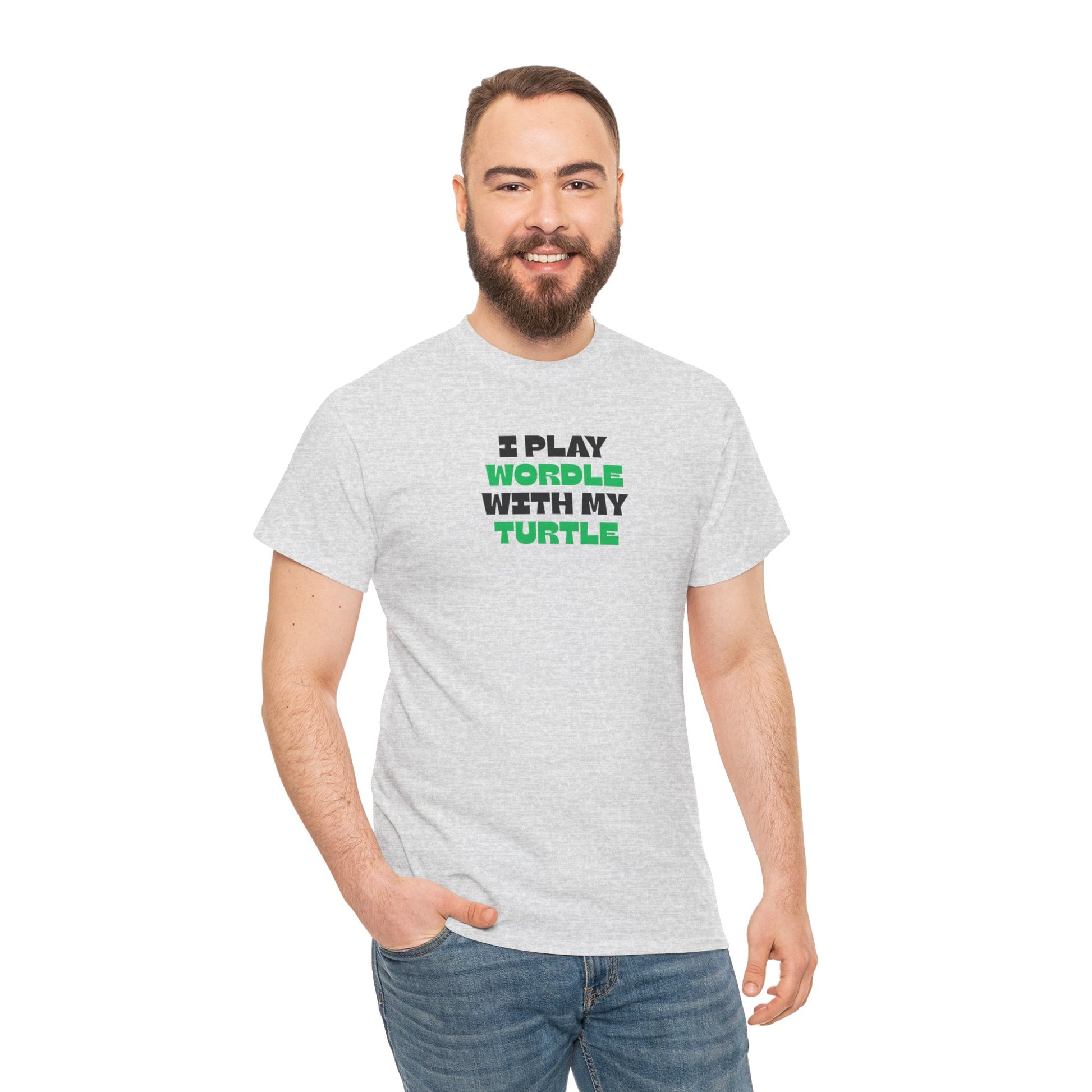 Man wearing a gray t-shirt with text 'I play wordle with my turtle' on a white background