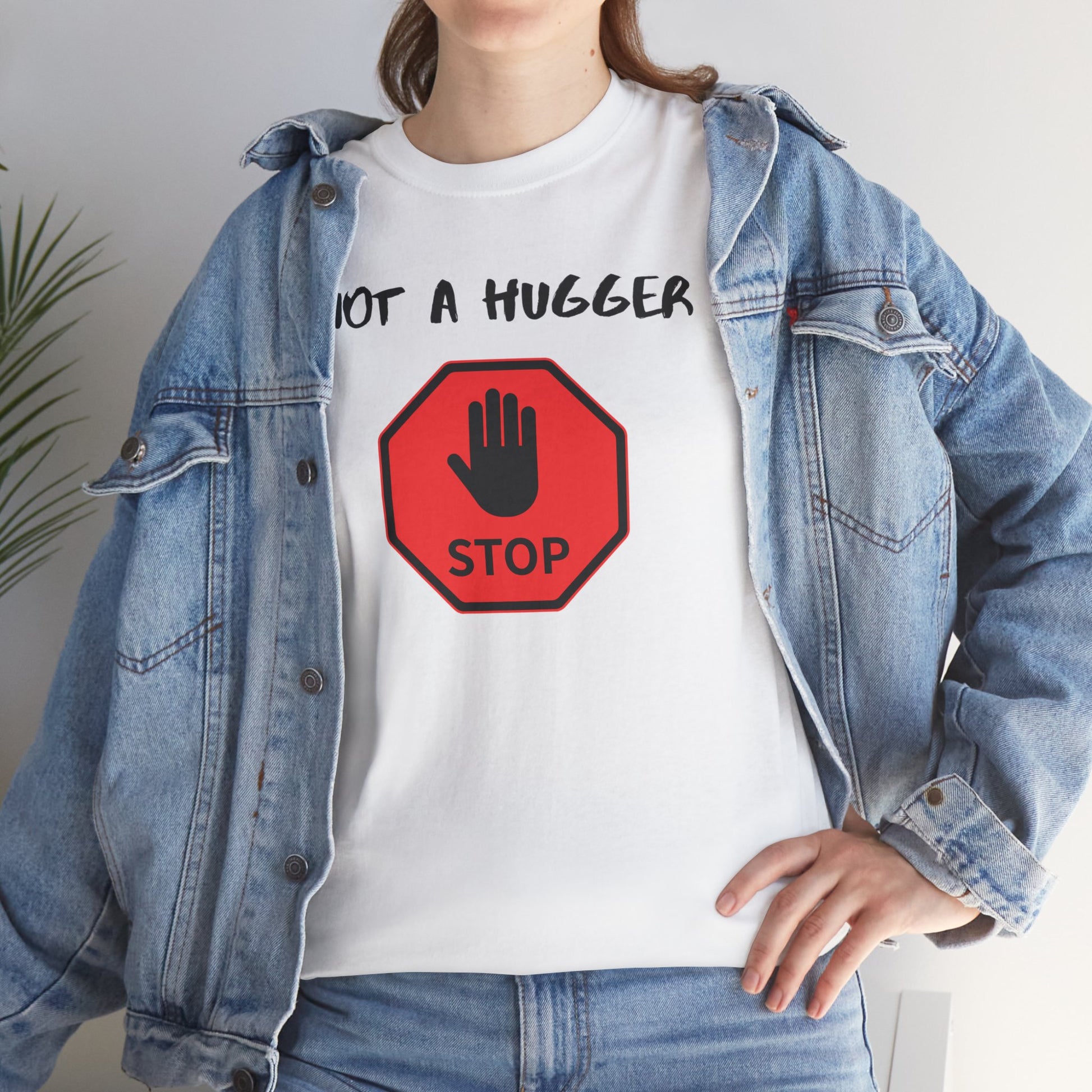 Person wearing a white t-shirt with a red stop sign graphic and text 'Not a hugger'.