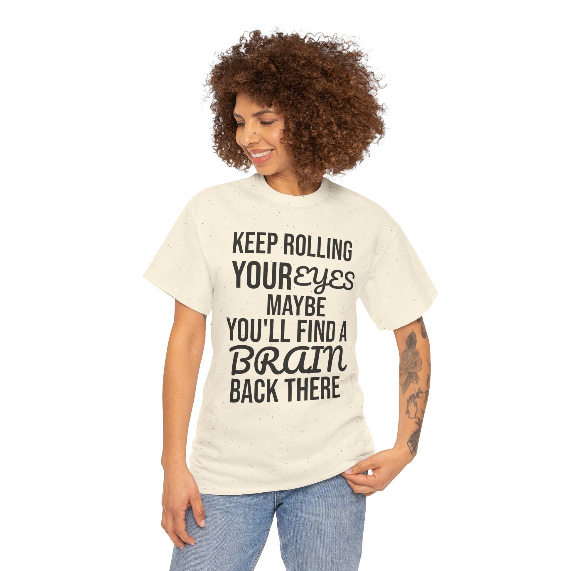Woman wearing a t-shirt with humorous text 'KEEP ROLLING YOUR EYES MAYBE YOU'LL FIND A BRAIN BACK THERE' design on a white background
