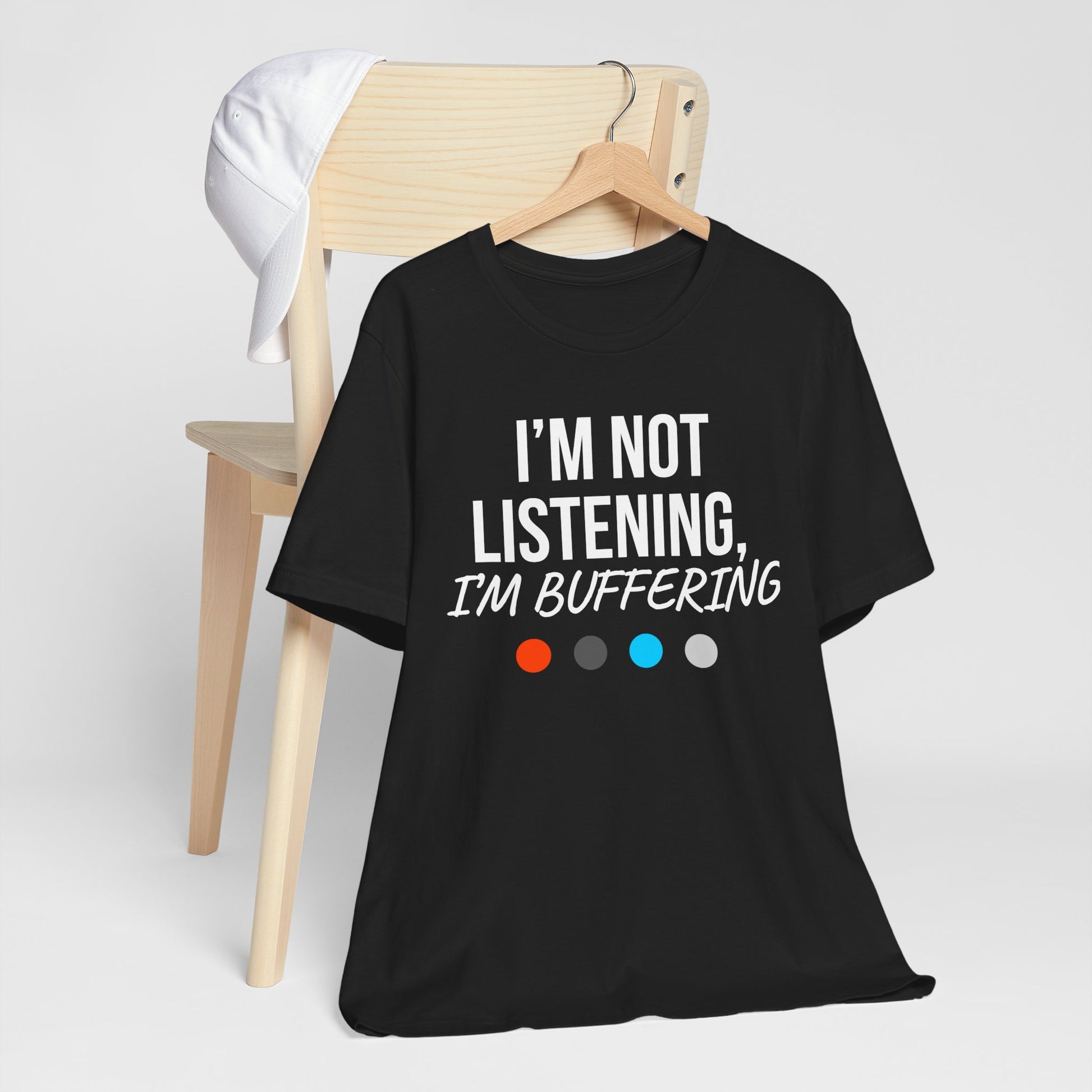 Black t-shirt with 'I'm not listening, I'm buffering' text on a white background