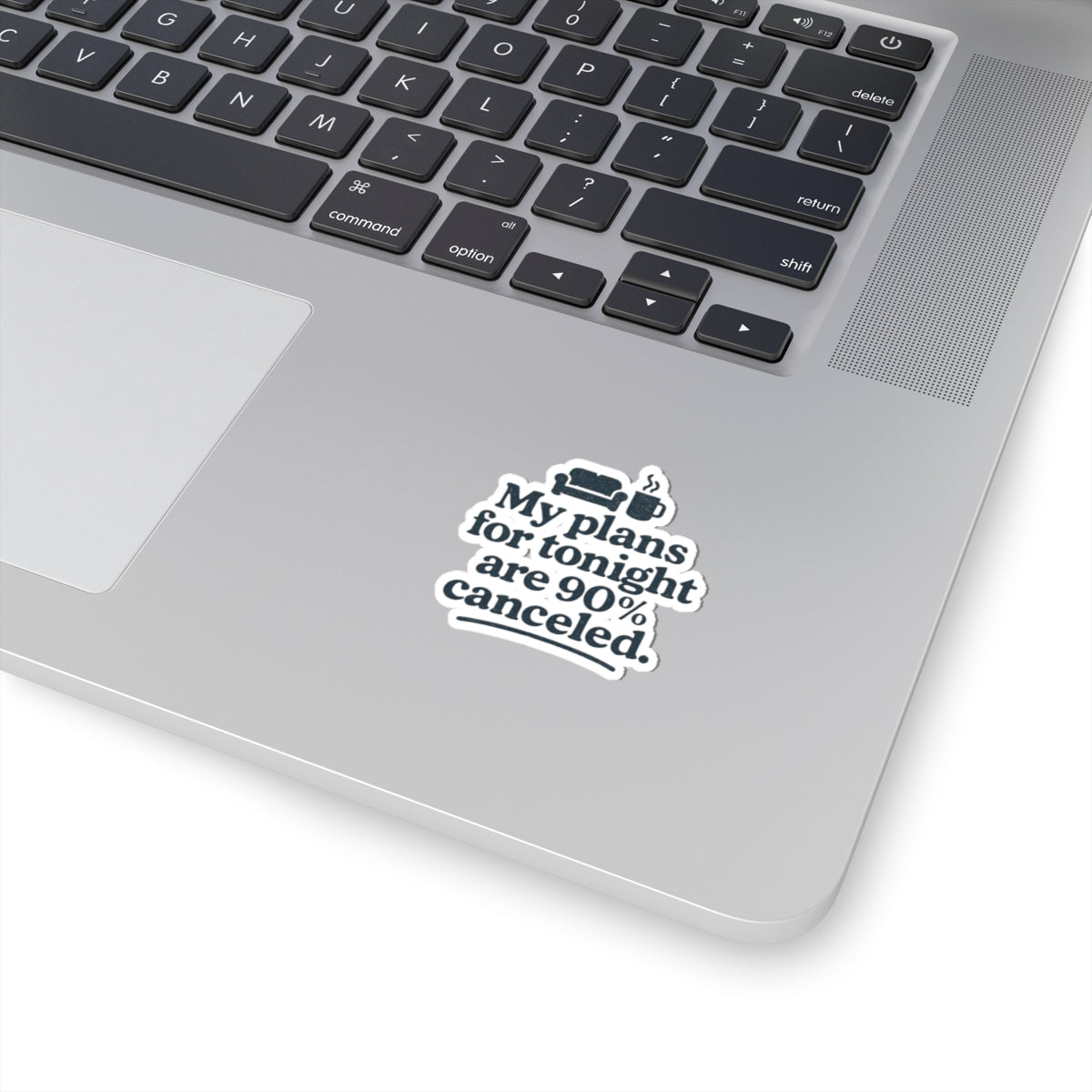 Laptop with a sticker reading 'My plans for tonight are 90% canceled.' on a white background