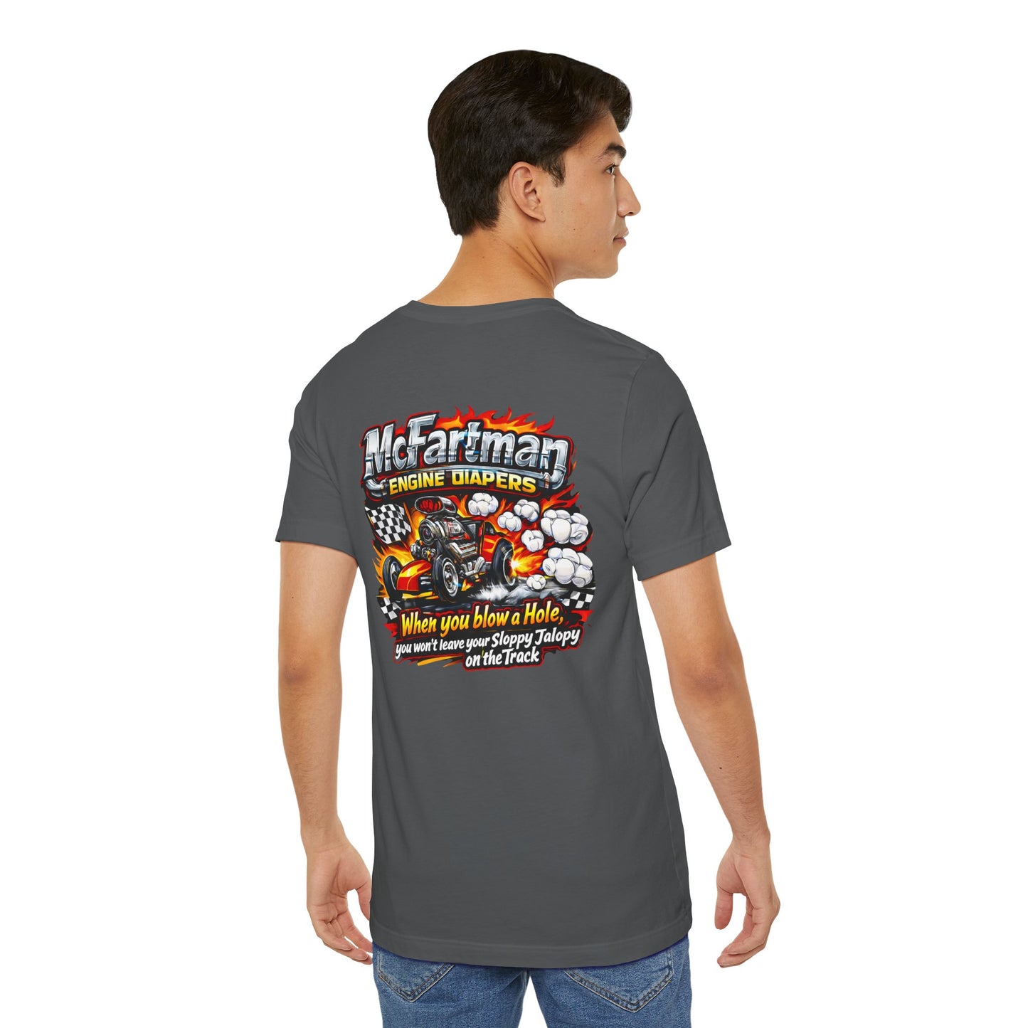 Person wearing a gray t-shirt with a colorful graphic and 'McFartman Engine Diapers When you blow a Hole, you won't leave your Sloppy Jalopy on the Track' text on the back.