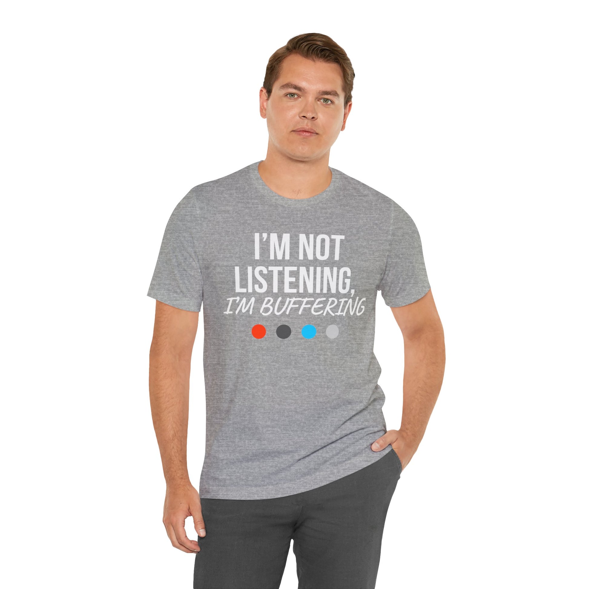 Man wearing a gray t-shirt with 'I'm Not Listening, I'm Buffering' text on a white background