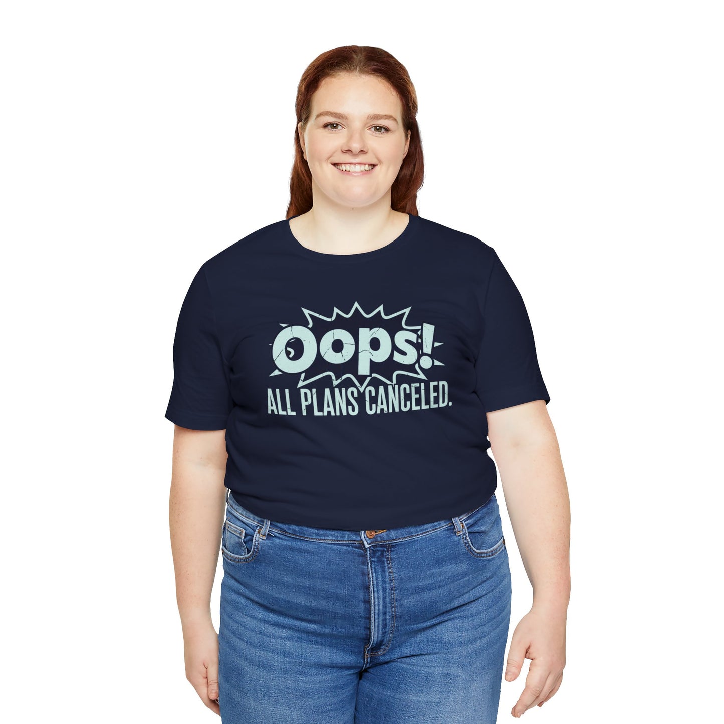 Person wearing a navy blue t-shirt with 'Oops! All Plans Canceled' text on a white background