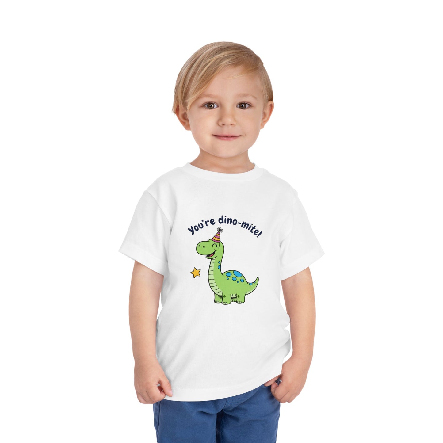 Child wearing a white t-shirt with a dinosaur graphic and text on a white background