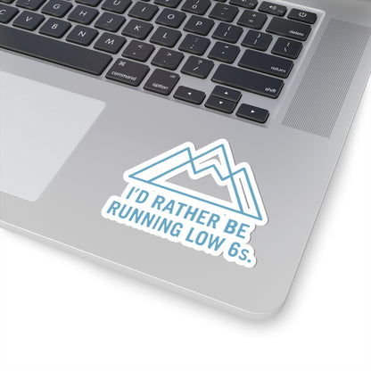 Laptop with a sticker reading 'I'd rather be running low 6s' on a white background