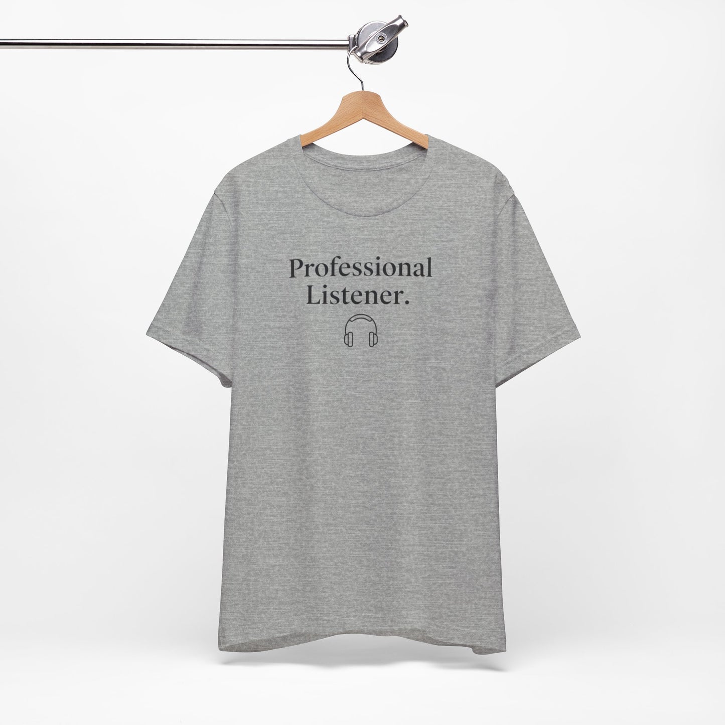 Gray t-shirt with 'Professional Listener' text on a hanger against a white background