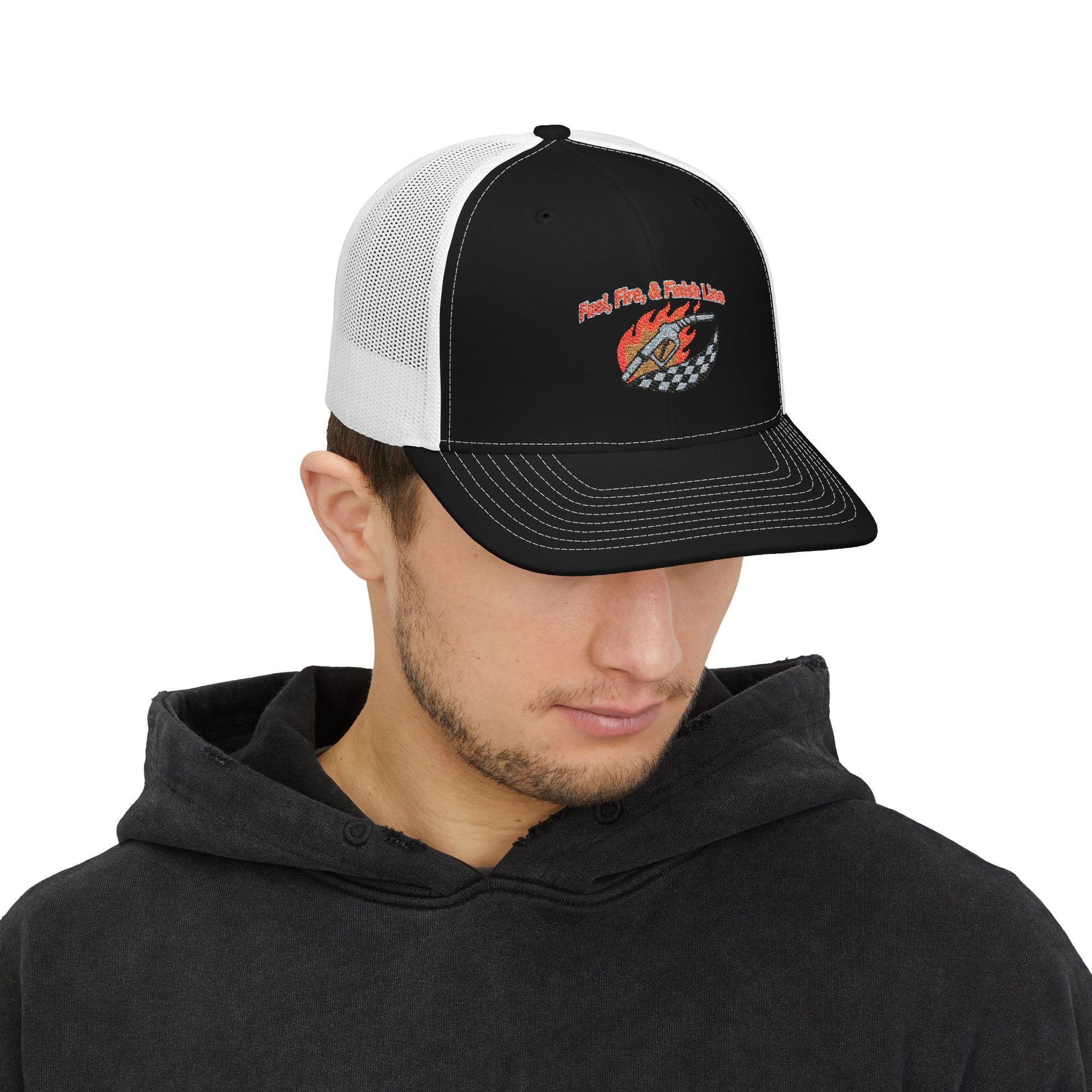Man wearing a black and white trucker hat with a logo and text 'Fuel, Fire & Finish Line' on a white background