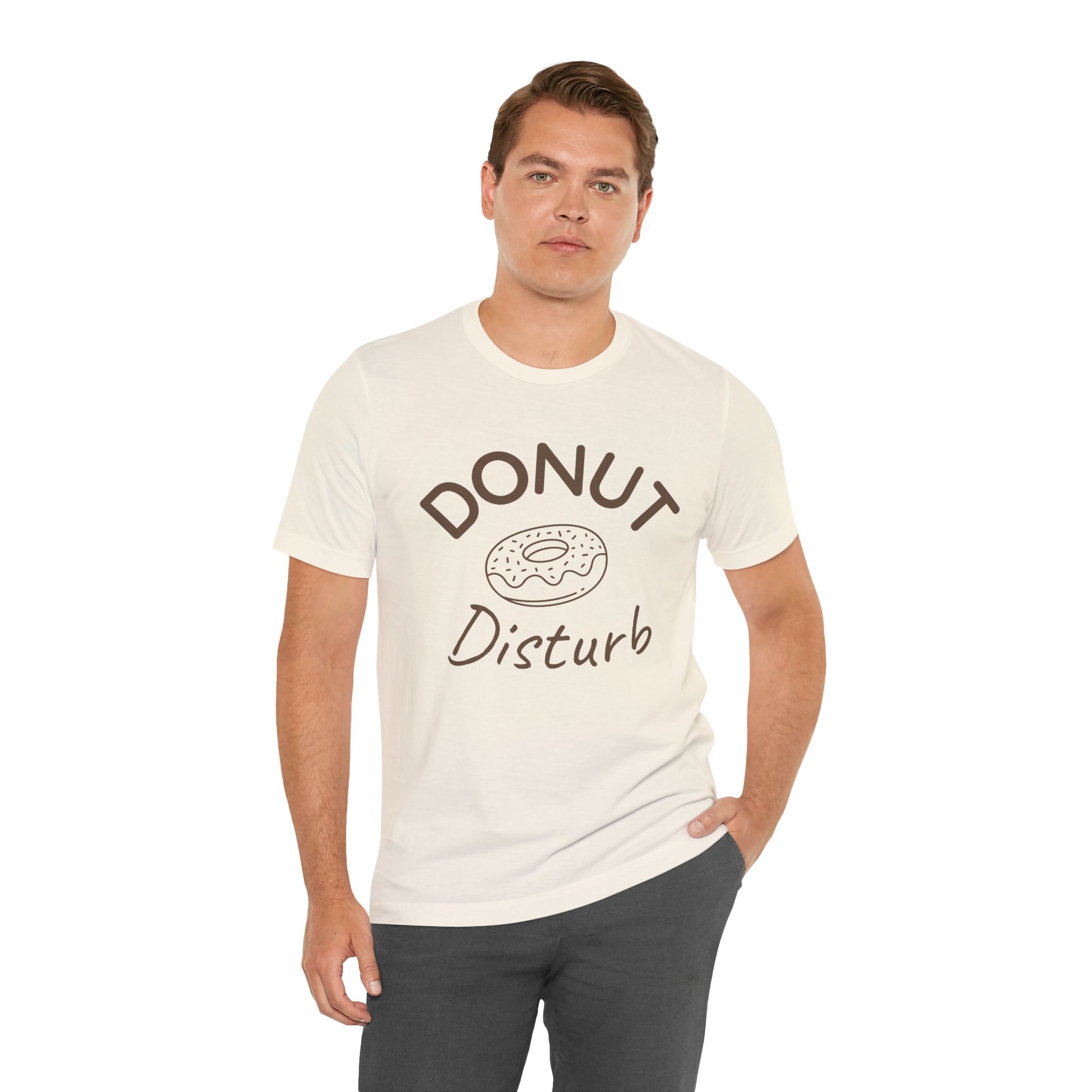 Man wearing a white t-shirt with 'DONUT Disturb' text and donut graphic on a white background