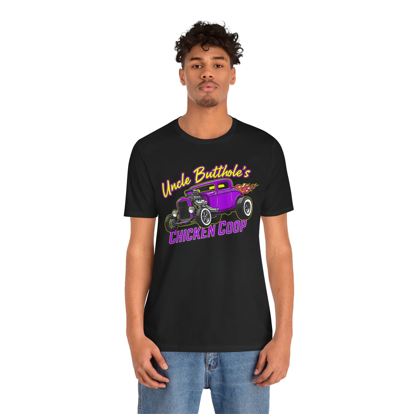 Man wearing a black Bella+Canvas 3001 t-shirt with purple hot rod graphic and text 'Uncle Butthole's Chicken Coop' on a white background