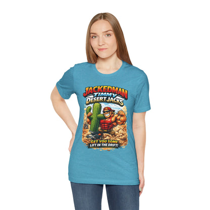 Woman wearing a blue t-shirt with a graphic design of a character and 'Jackedman Timmy Desert Jacks Get You Some Lift In The Drift' text.
