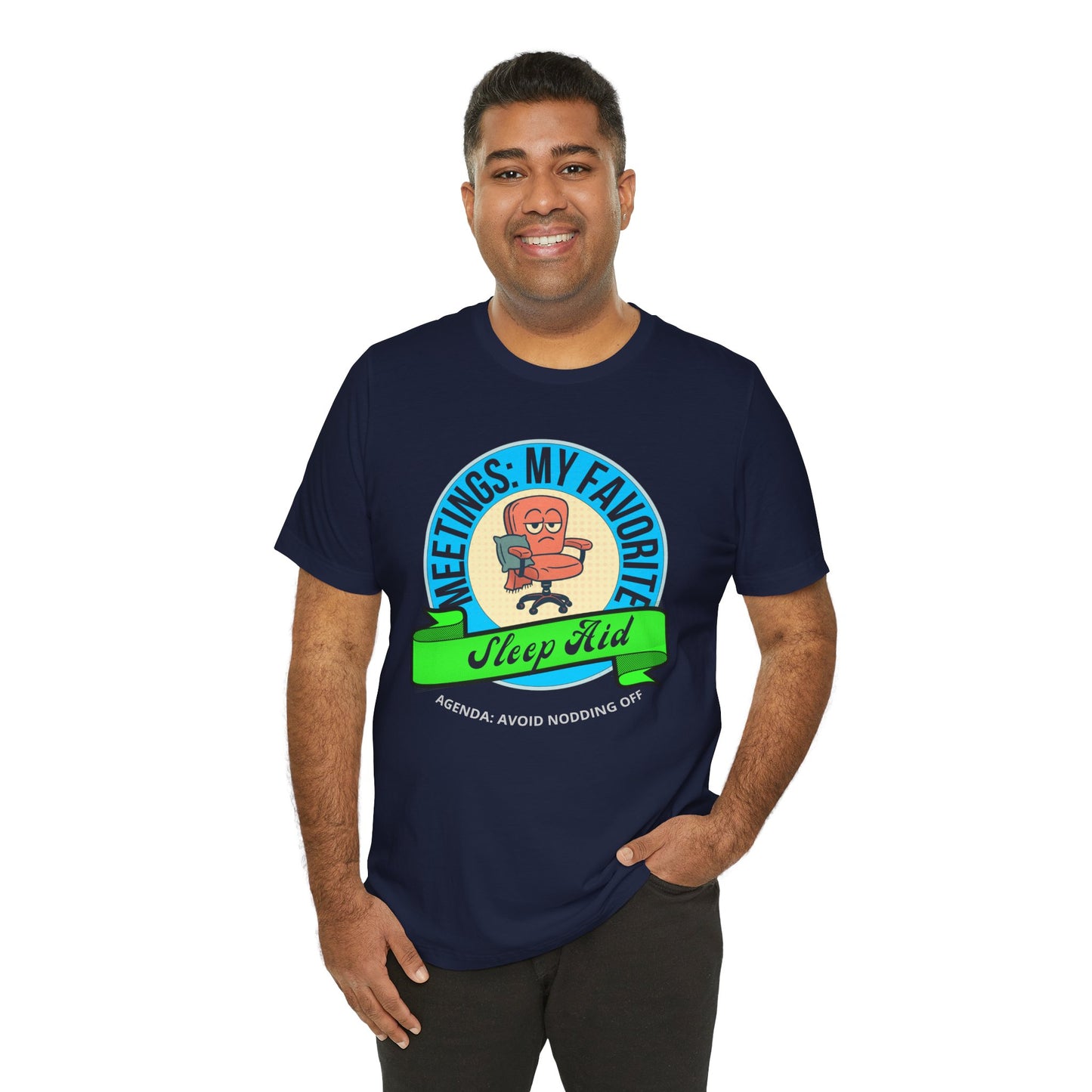 Man wearing a navy-blue t-shirt with a graphic design and text 'Meetings: My favorite sleep aid. Agenda: Avoid nodding off' on a white background