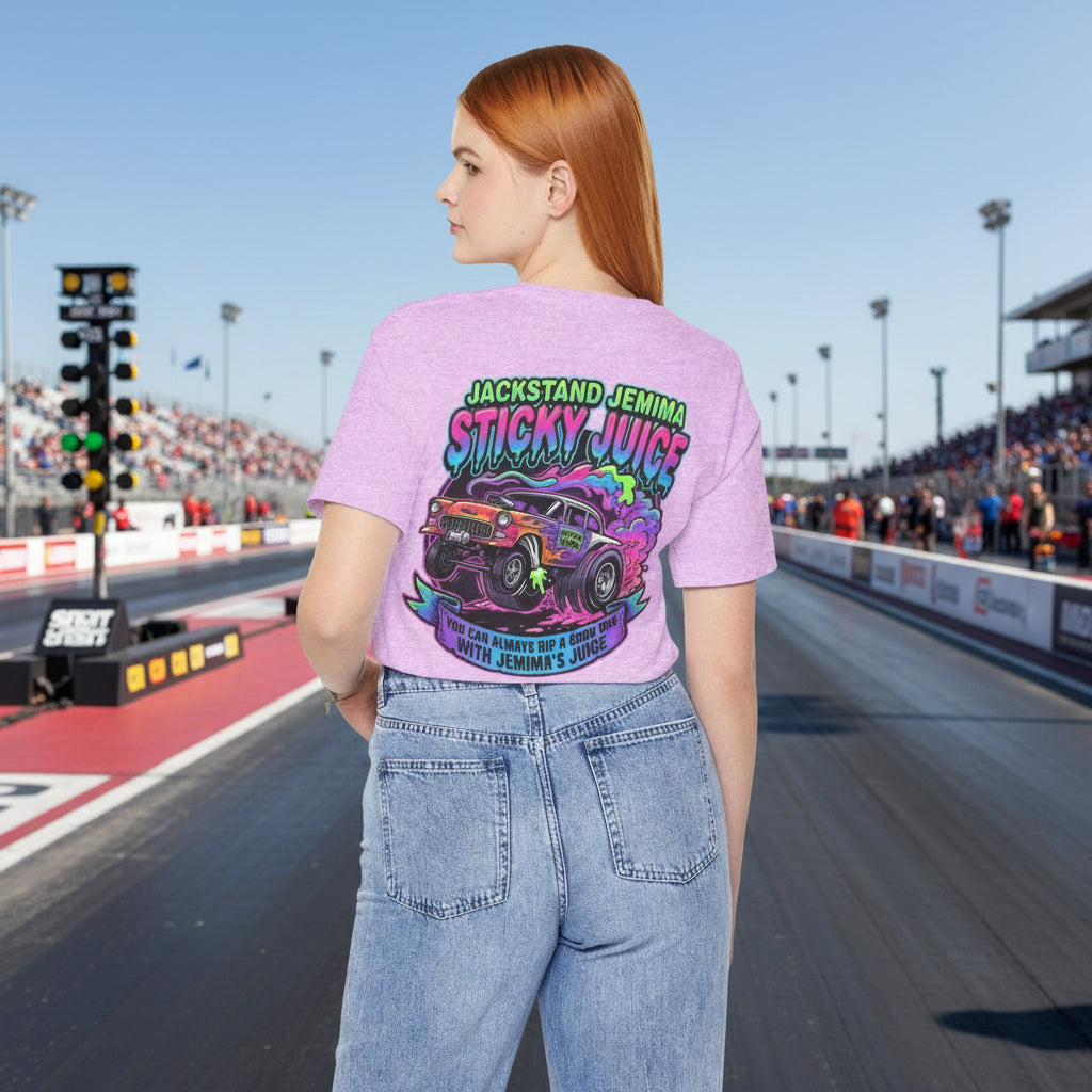 Person wearing a purple t-shirt with a colorful graphic and 'Jackstand Jemima Sticky Juice You Can Always Rip A Good One With Jemima's Juice' text on the back, standing on a drag strip background.