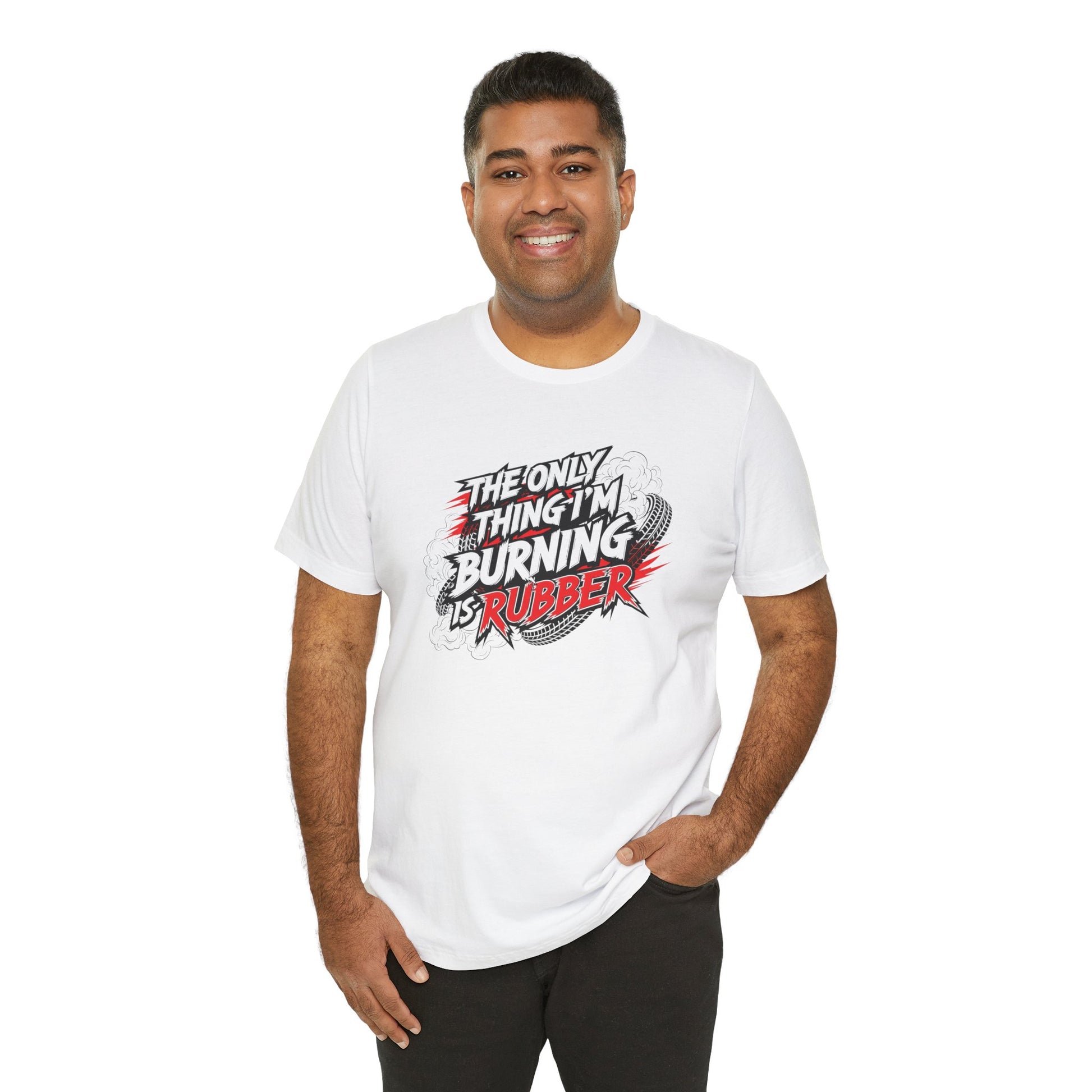 Man wearing a white t-shirt with a graphic design and text 'The only thing I'm burning is rubber' on a white background