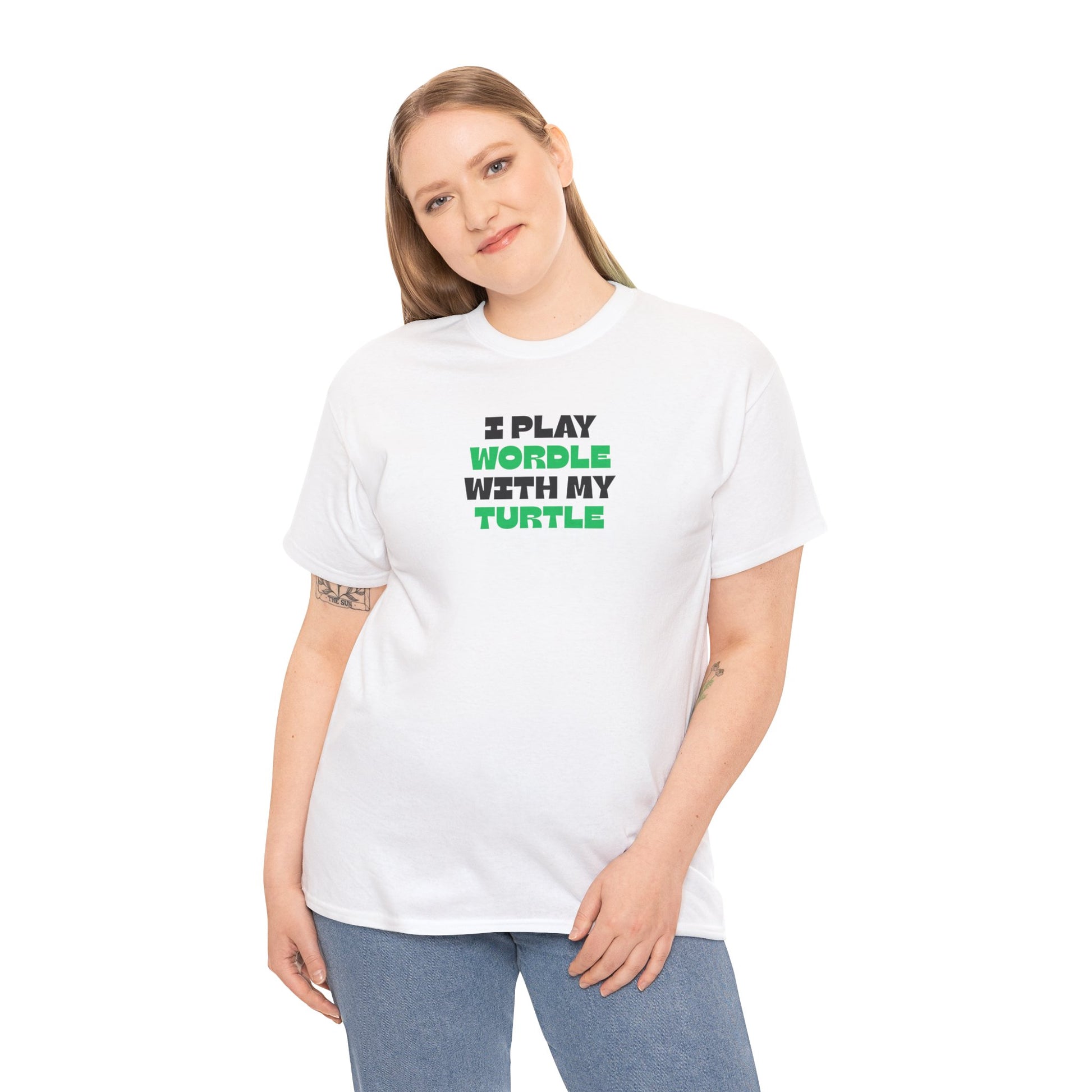 Person wearing a white t-shirt with green text 'I play wordle with my turtle' on a white background