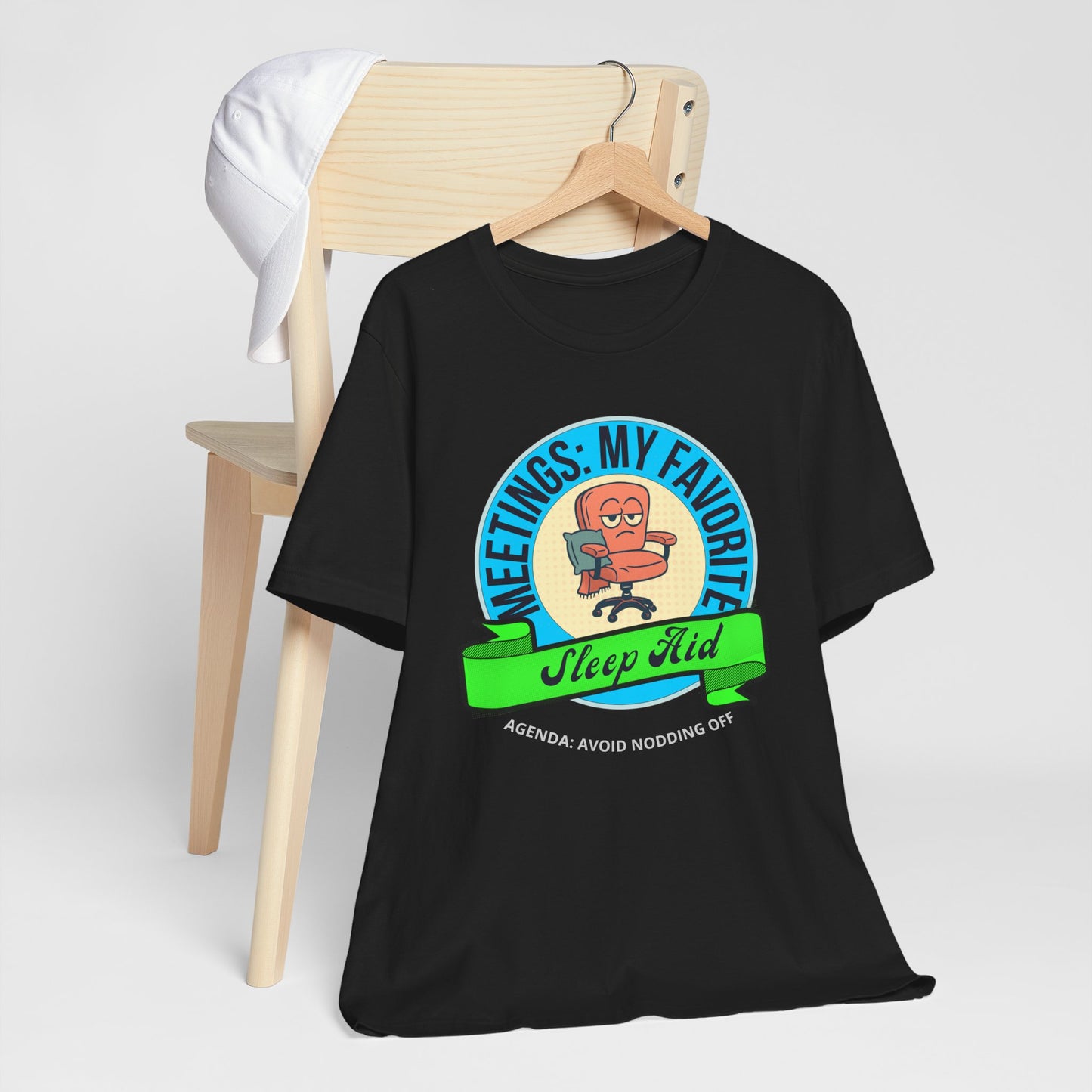 Black t-shirt with a graphic design on a wooden chair against a white background
