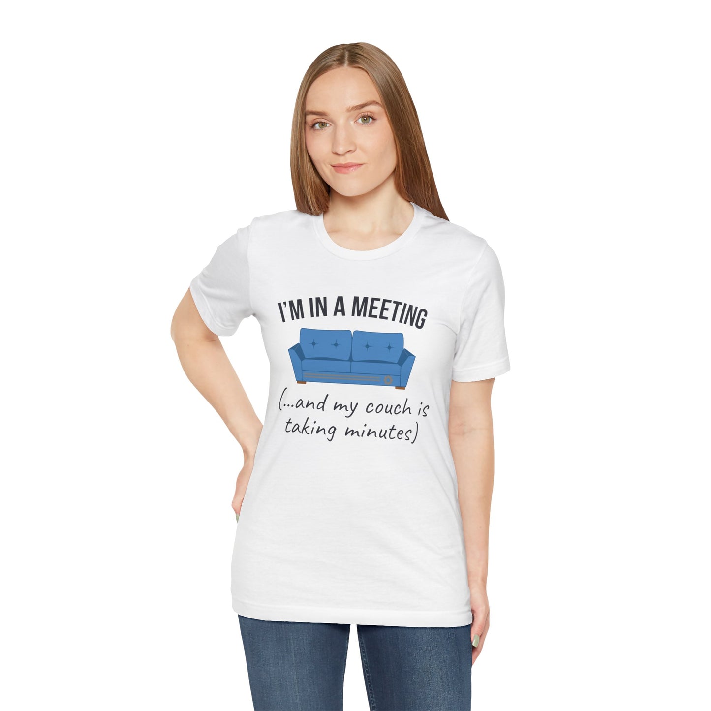 Woman wearing a white t-shirt with a humorous graphic and text 'I'm in a meeting (...and my couch is taking minutes)' on a white background