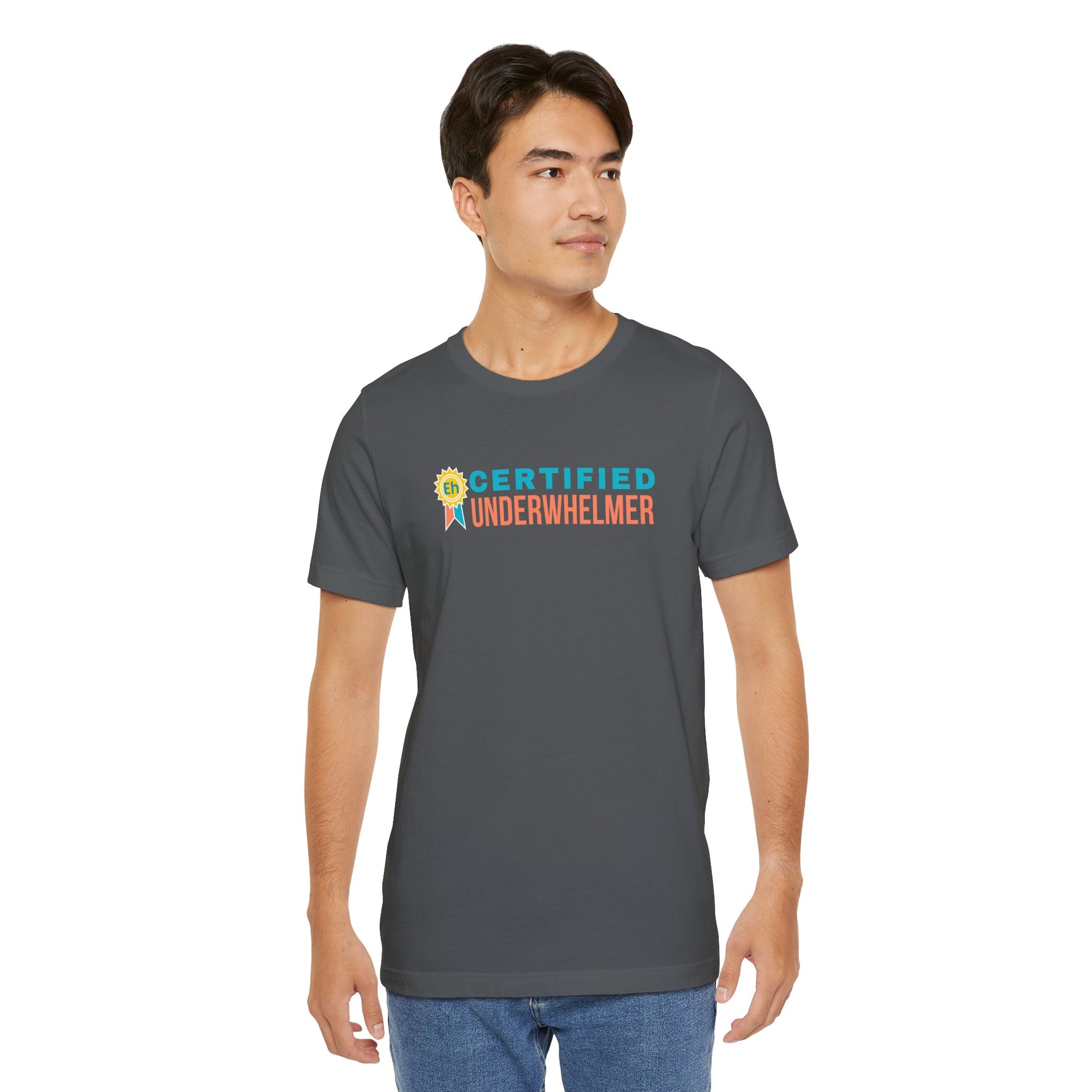 Man wearing a gray t-shirt with 'Certified Underwhelmer' text on a white background