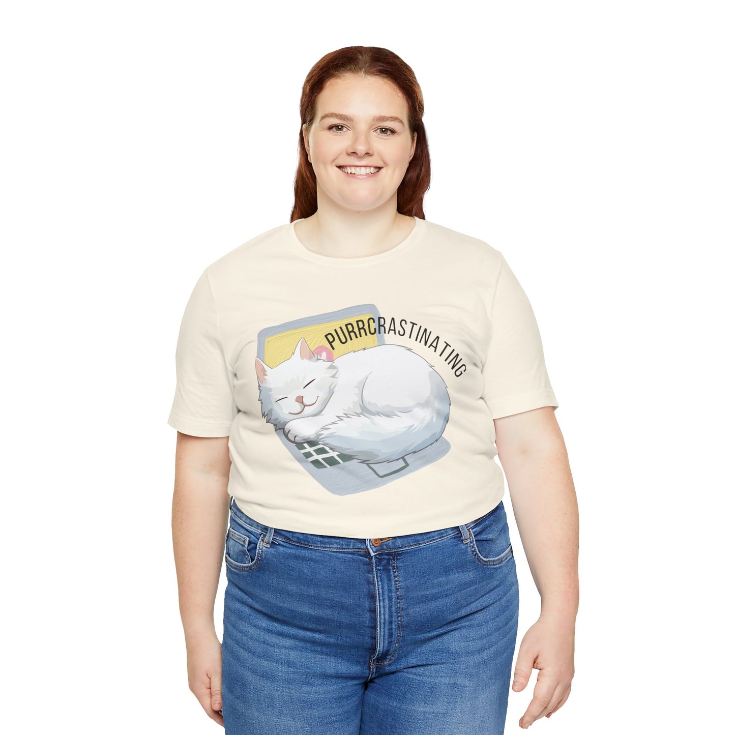 Person wearing a cream t-shirt with a cat graphic and text Purrcrastinating' on a white background