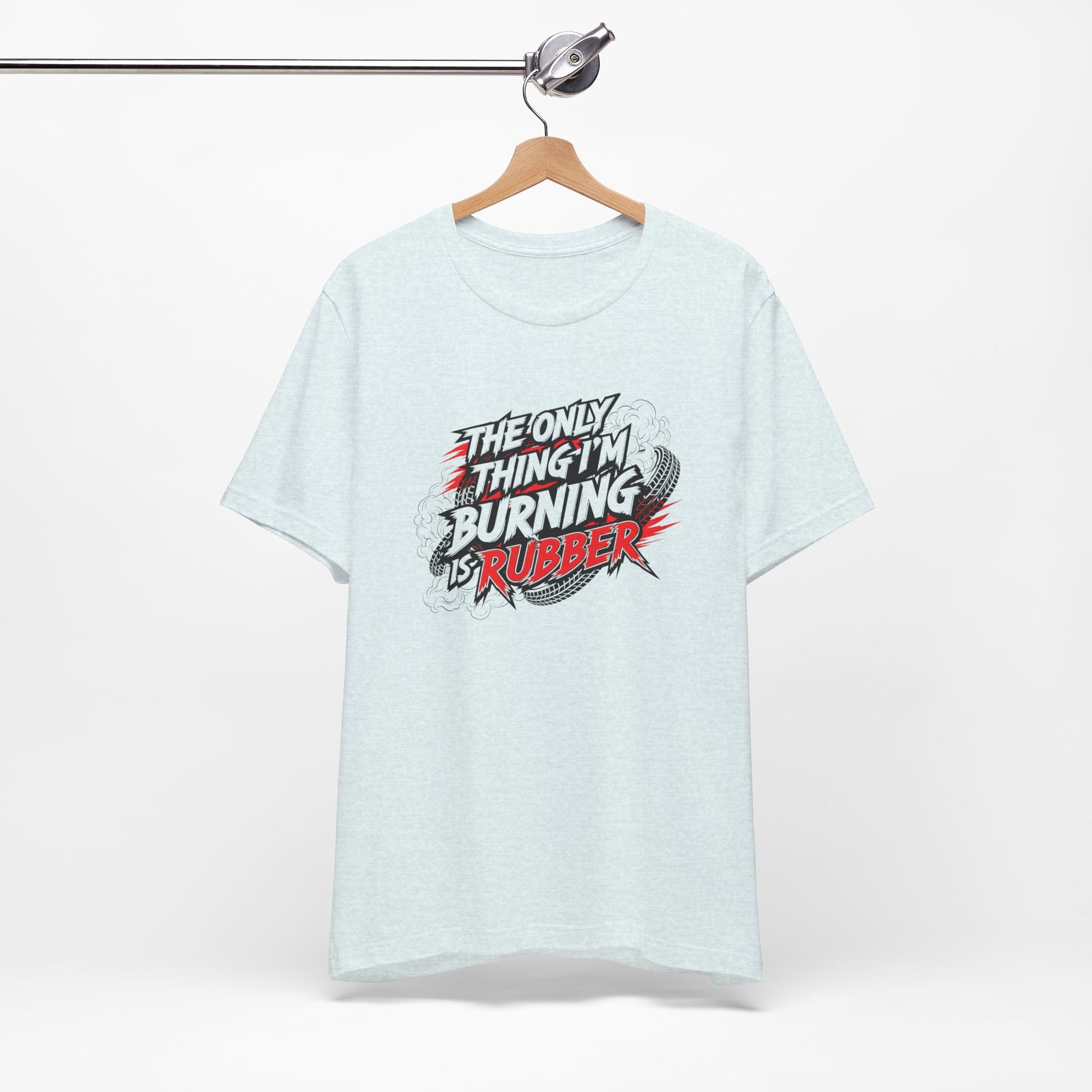 Light blue t-shirt with graphic text 'The only thing I'm burning is rubber' on a white background
