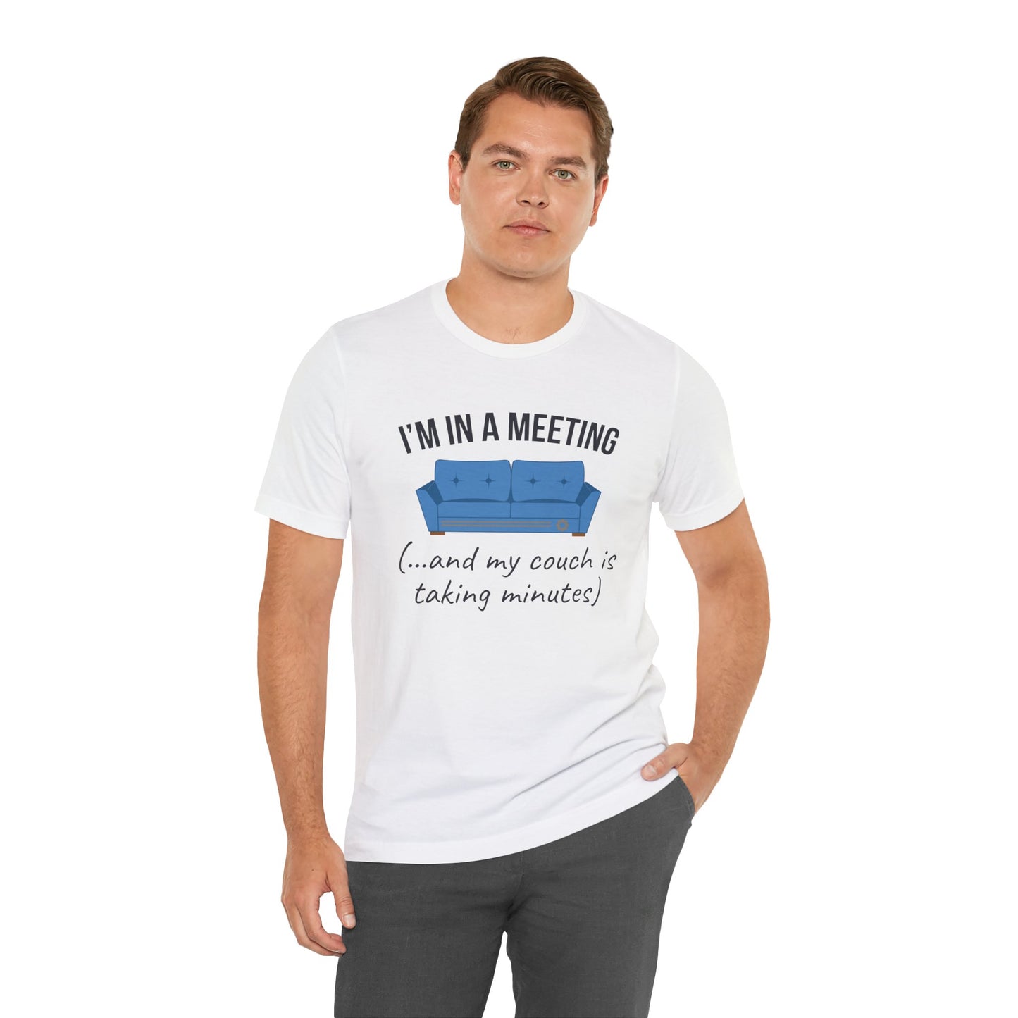 Man wearing a white t-shirt with a humorous graphic and text 'I'm in a meeting (...and my couch is taking minutes)' on a white background