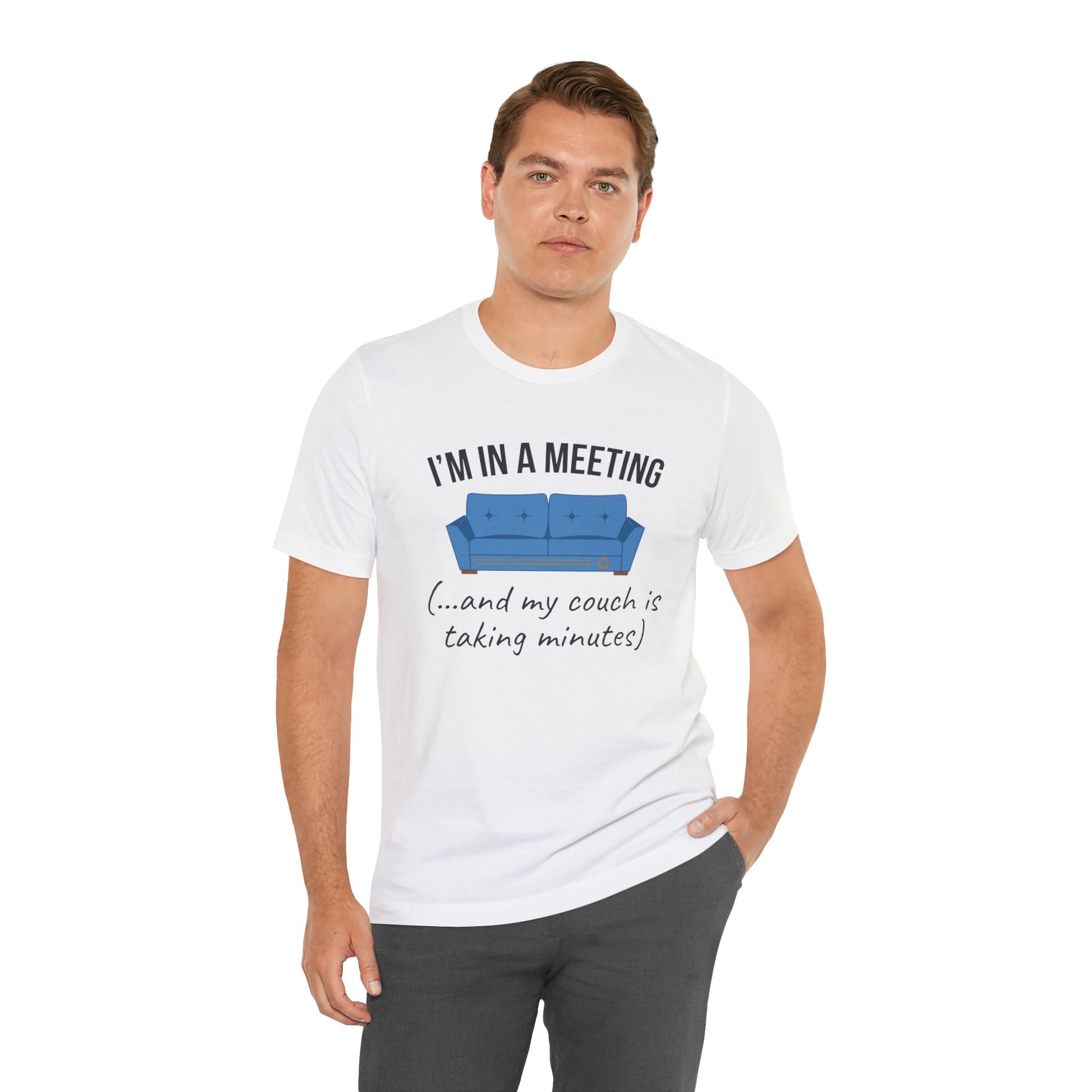 Man wearing a white t-shirt with a humorous graphic and text 'I'm in a meeting (...and my couch is taking minutes)' on a white background