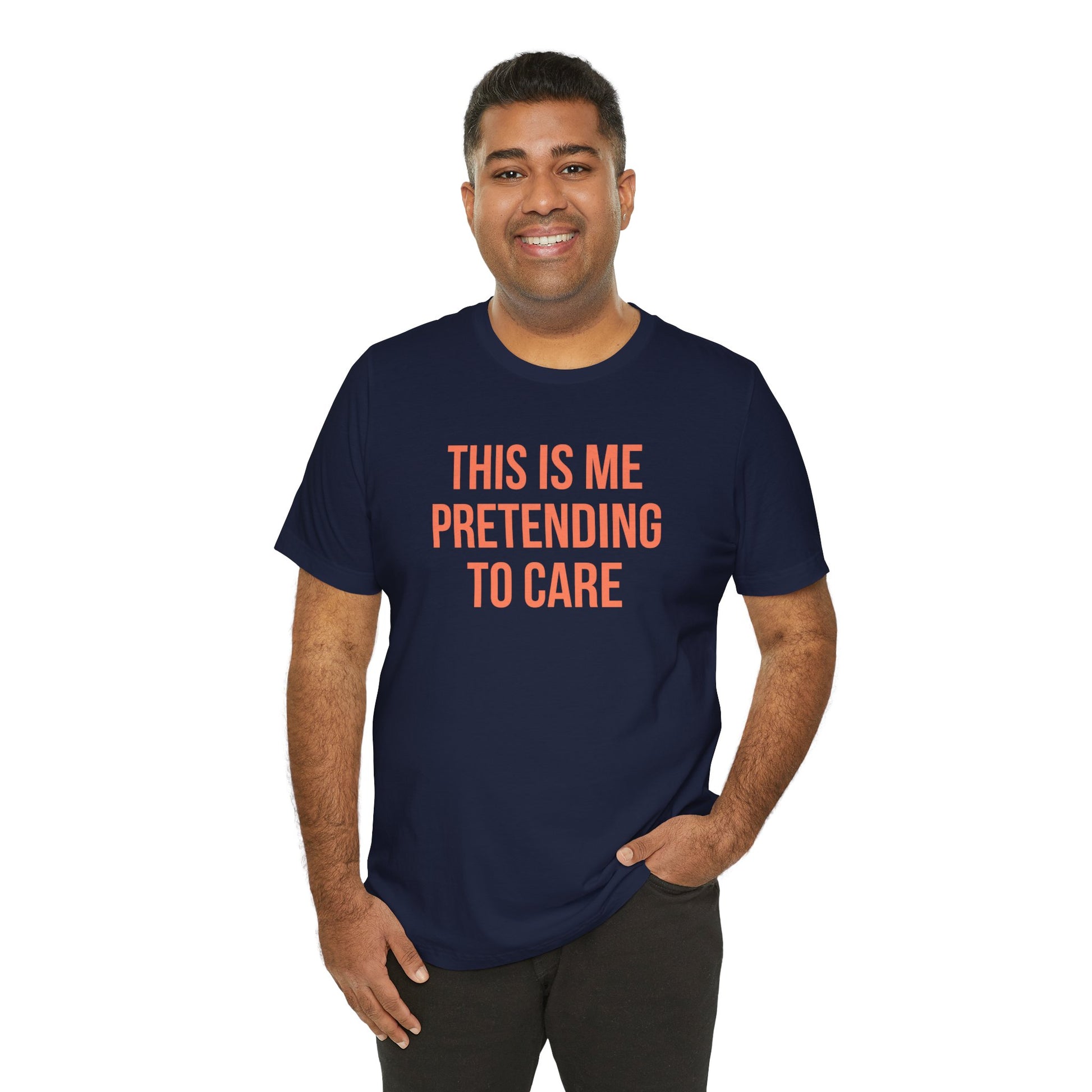 Man wearing a navy blue t-shirt with red text 'This is me pretending to care' on a white background