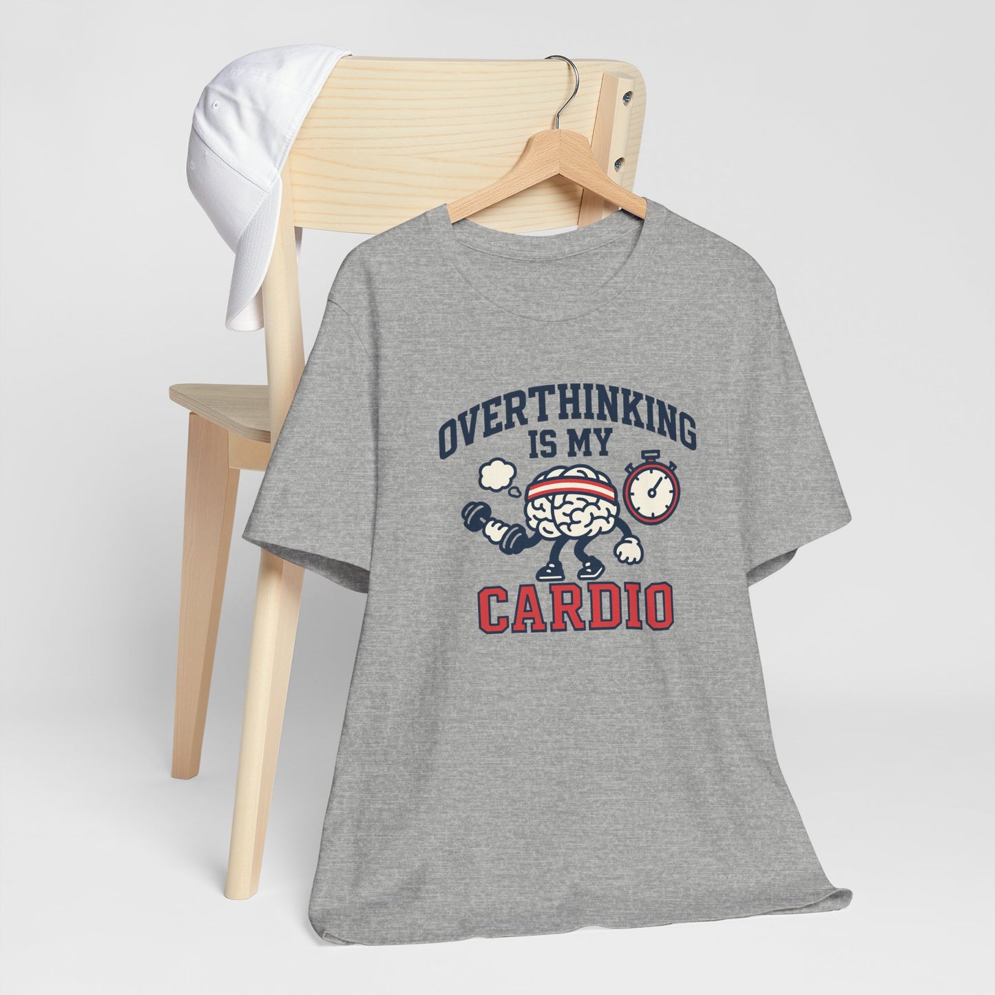 Gray t-shirt with humorous design on a wooden chair against a white background