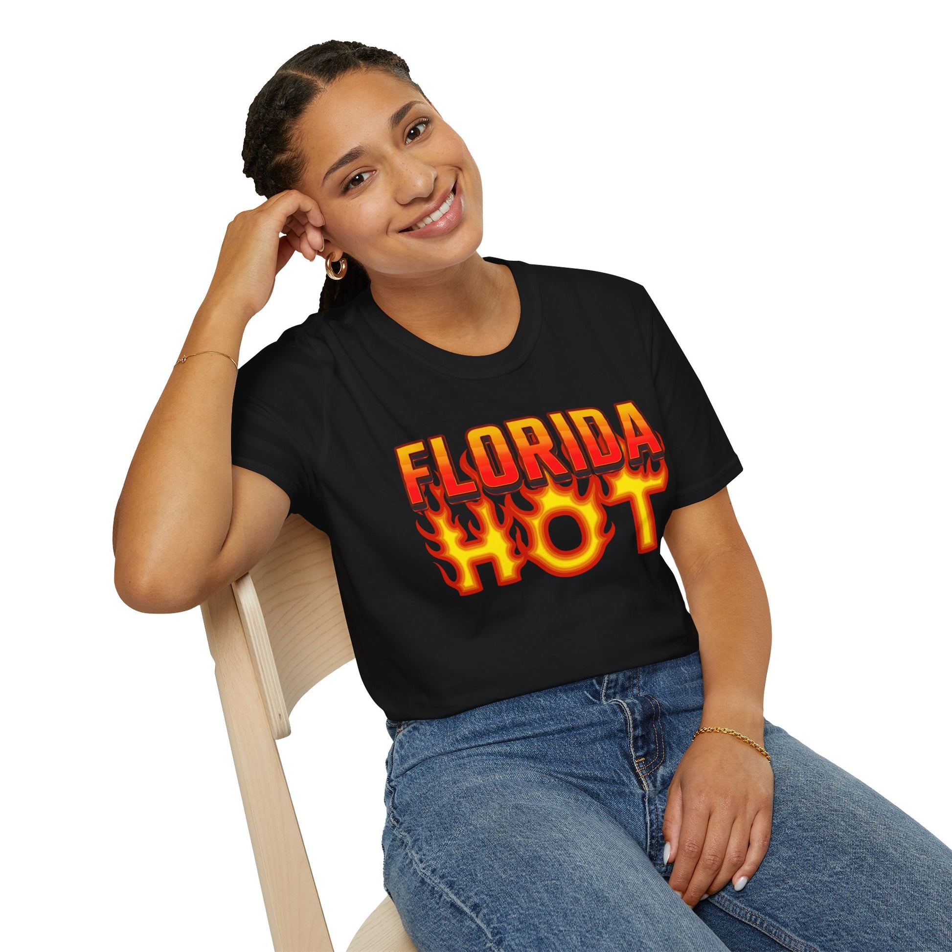 Person wearing a black t-shirt with 'Florida Hot' design, sitting on a chair.