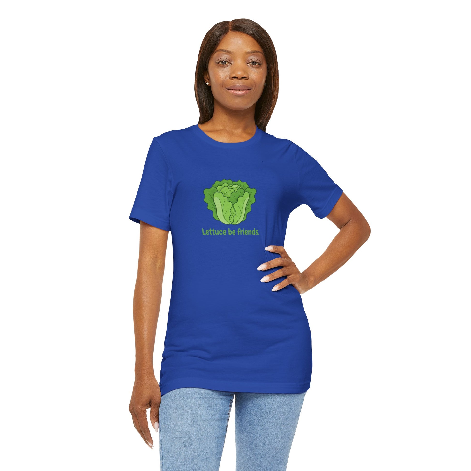 Woman wearing a blue t-shirt with a green graphic and text 'Lettuce be friends' on a white background