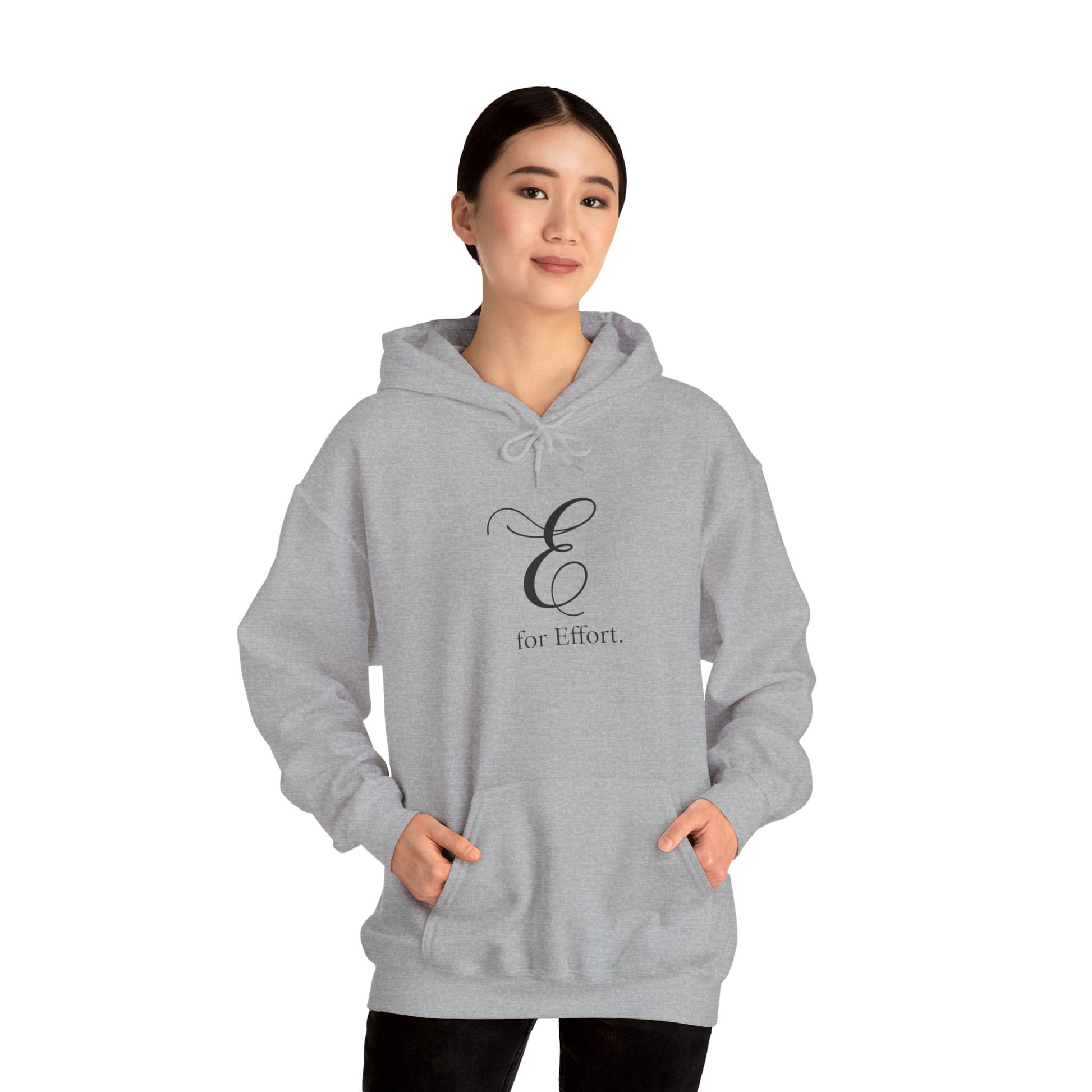 Person wearing a gray hoodie with a logo and text 'E for Effort' on a white background