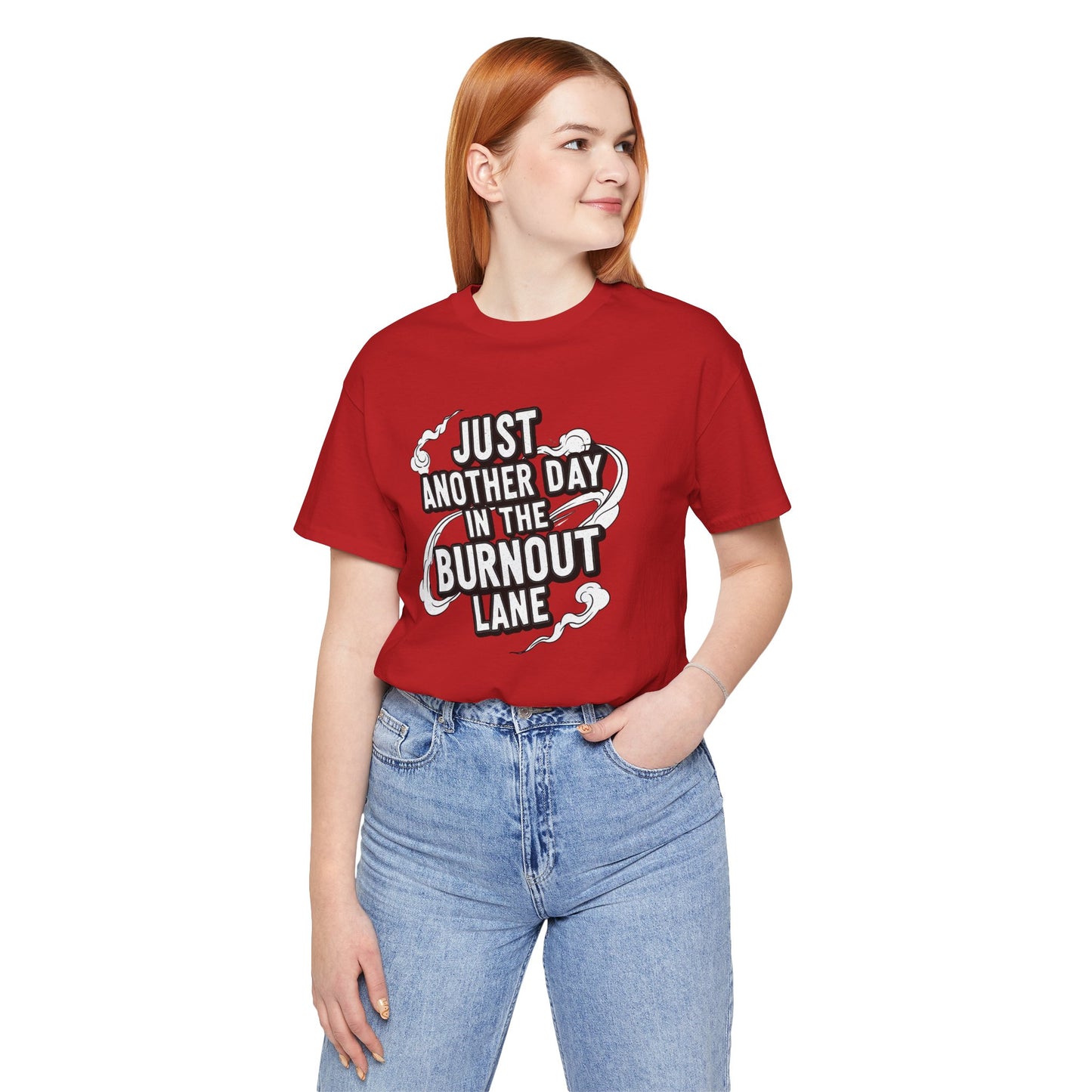 Person wearing a red t-shirt with text and jeans on a white background