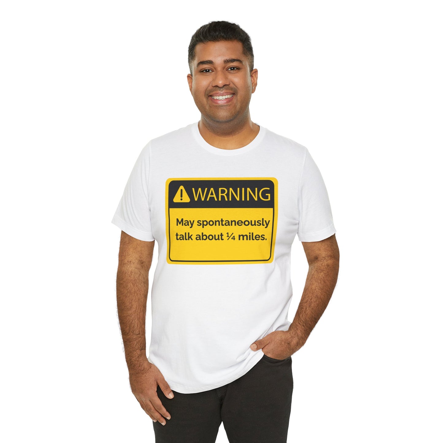 Man wearing a white t-shirt with a humorous warning sign 'WARNING May spontaneously talk about 1/4 miles' graphic on a white background
