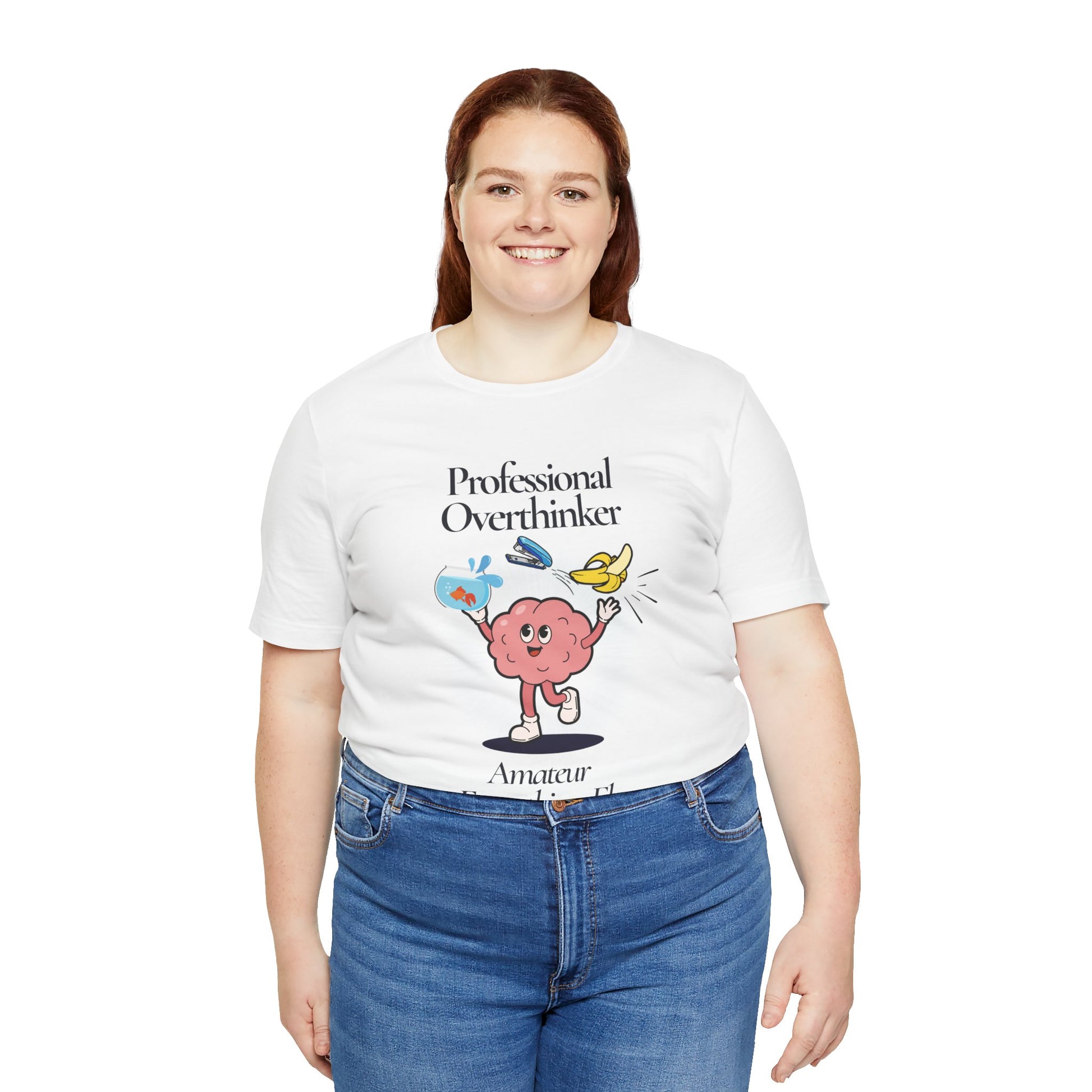 Person wearing a white t-shirt with a graphic and text 'Professional Overthinker, Amateur Everything Else', standing against a white background