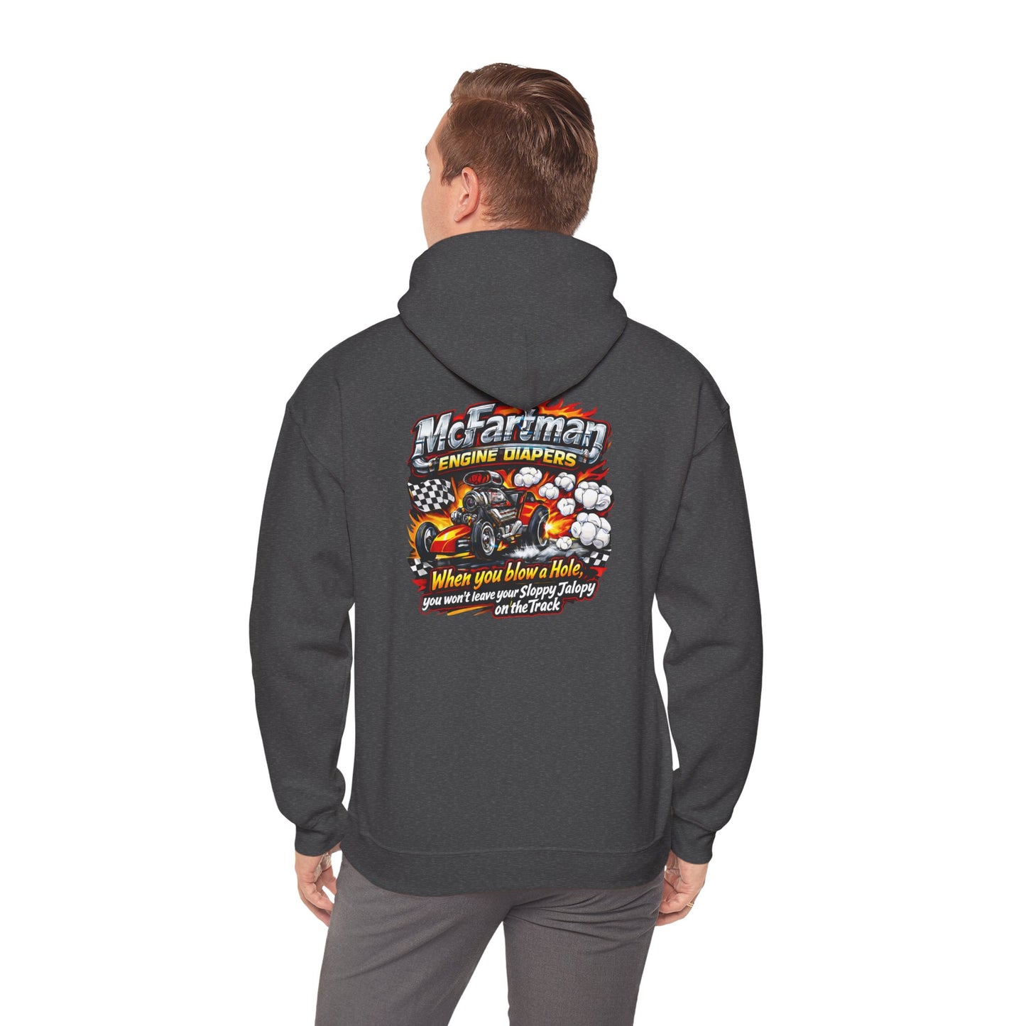 Person wearing a dark gray hoodie with a colorful graphic and  'McFartman Engine Diapers When You Blow a Hole You Won't Leave Your Sloppy Jalopy On The Track' text on the back, standing against a white background.