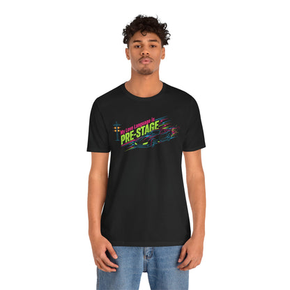 Person wearing a black t-shirt with colorful text 'My Love Language is Pre-Stage' and graphics on a white background