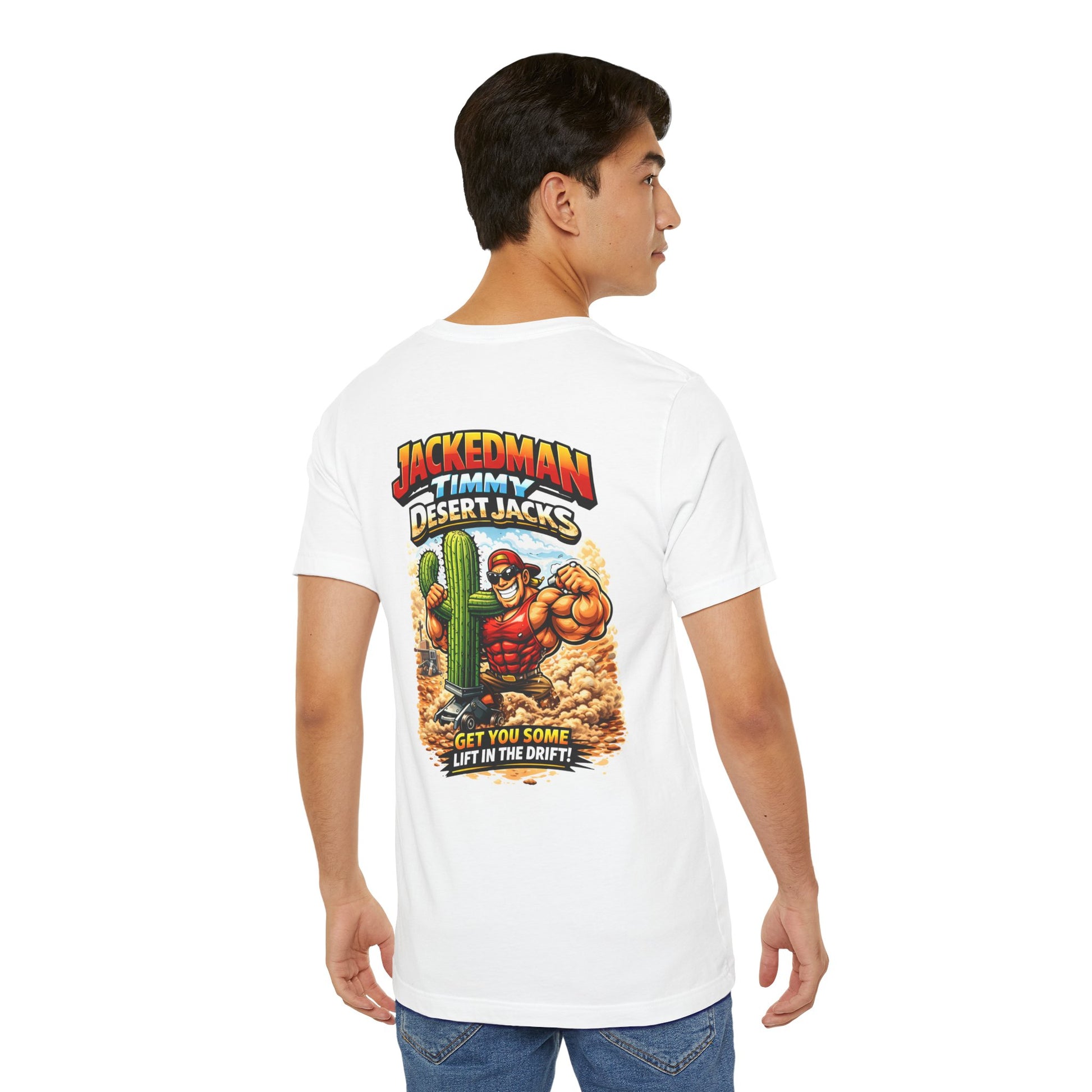 Person wearing a white t-shirt with a colorful graphic design on the back, featuring 'Jackedman Timmy Desert Jacks Get You Some Lift In The Drift'  text and a character.