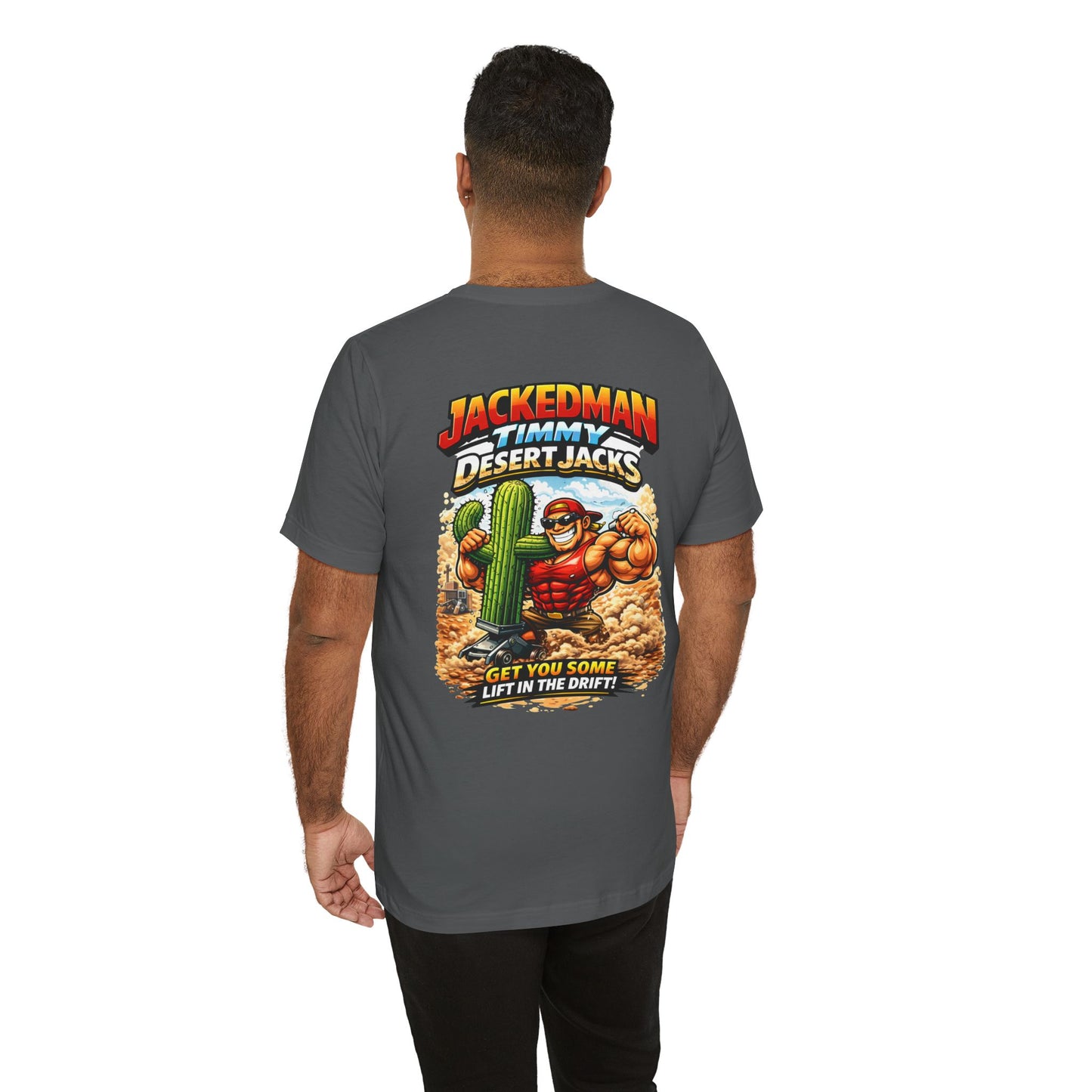 Person wearing a gray t-shirt with a colorful graphic on the back, featuring 'Jackedman Timmy Desert Jacks Get You Some Lift In The Drift' text and a cartoon character.