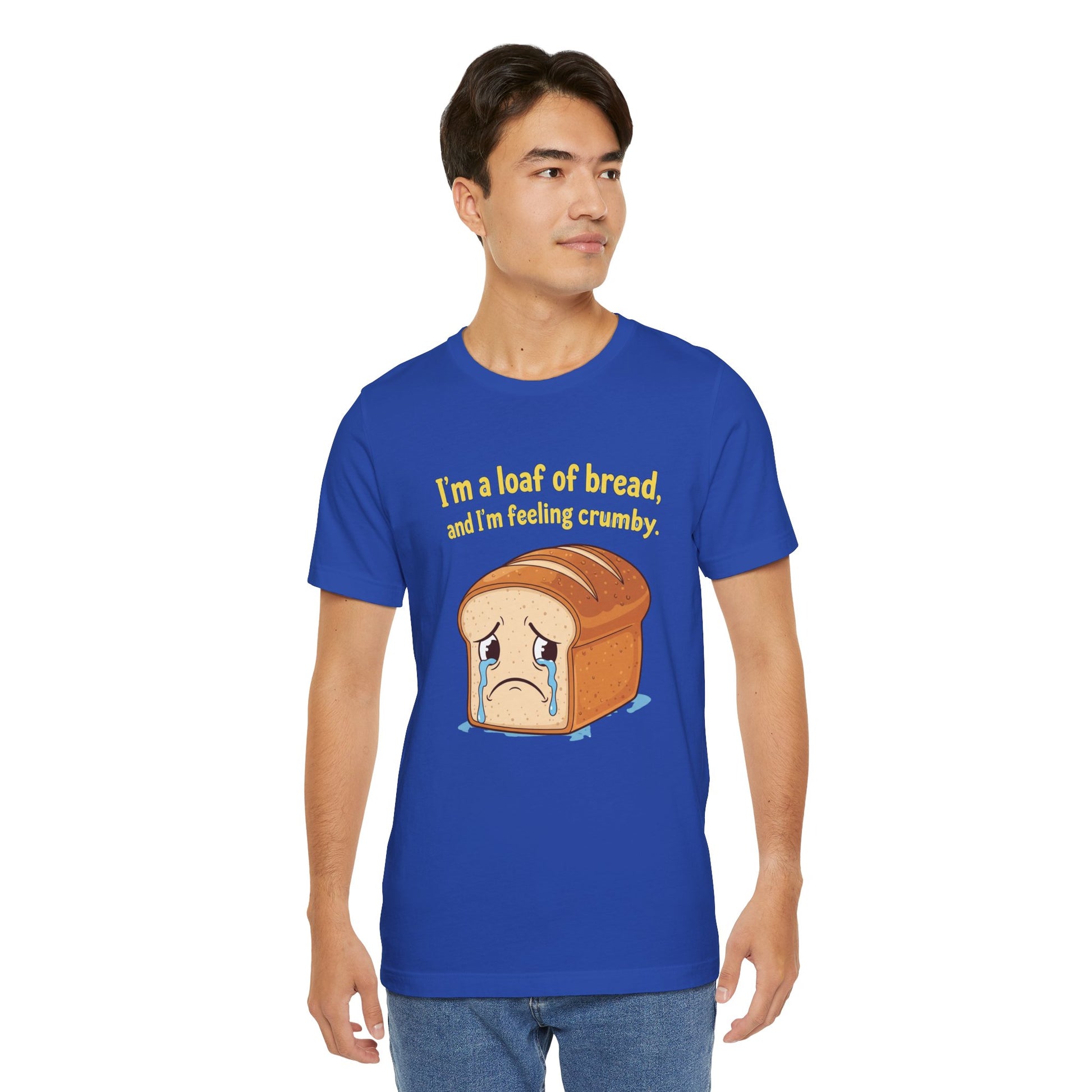 Person wearing a blue t-shirt with a bread graphic and text on a white background. Text says, 'I'm a loaf of bread, and I'm feeling crumby'