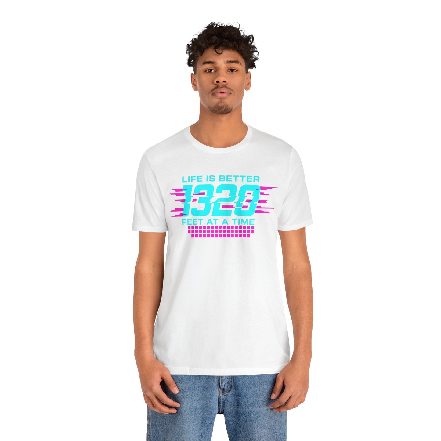 Person wearing a white t-shirt with colorful text 'Life is better 1320 feet at a time' design on a white background