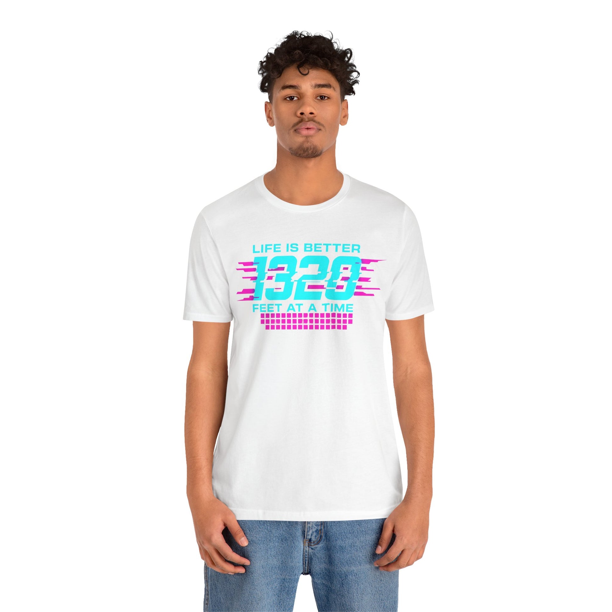 Person wearing a white t-shirt with colorful text 'Life is better 1320 feet at a time' design on a white background