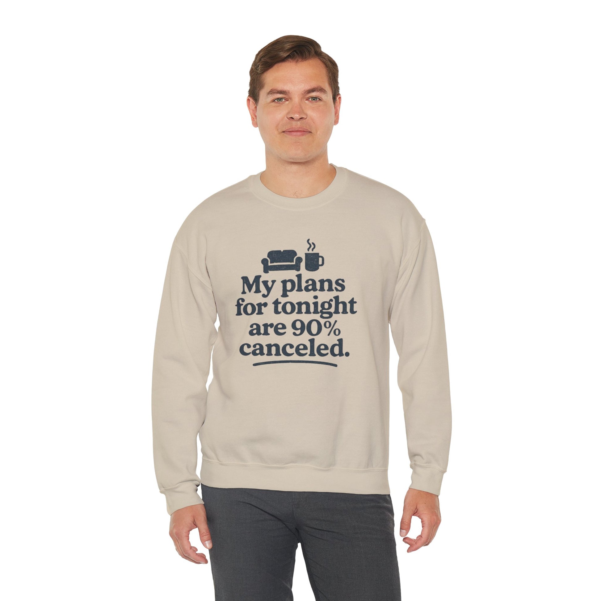Man wearing a beige sweatshirt with text 'My plans for tonight are 90% canceled' on a white background