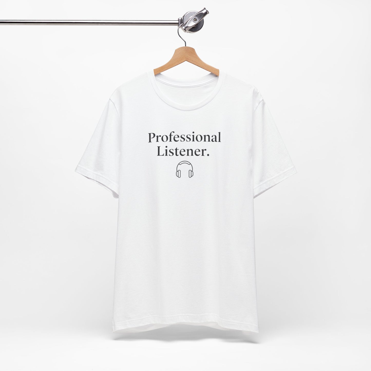 White t-shirt with 'Professional Listener' text on a hanger against a white background