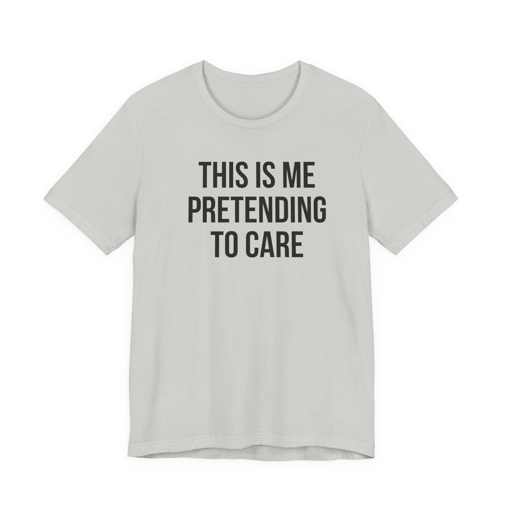Gray t-shirt with black text 'THIS IS ME PRETENDING TO CARE' on a white background