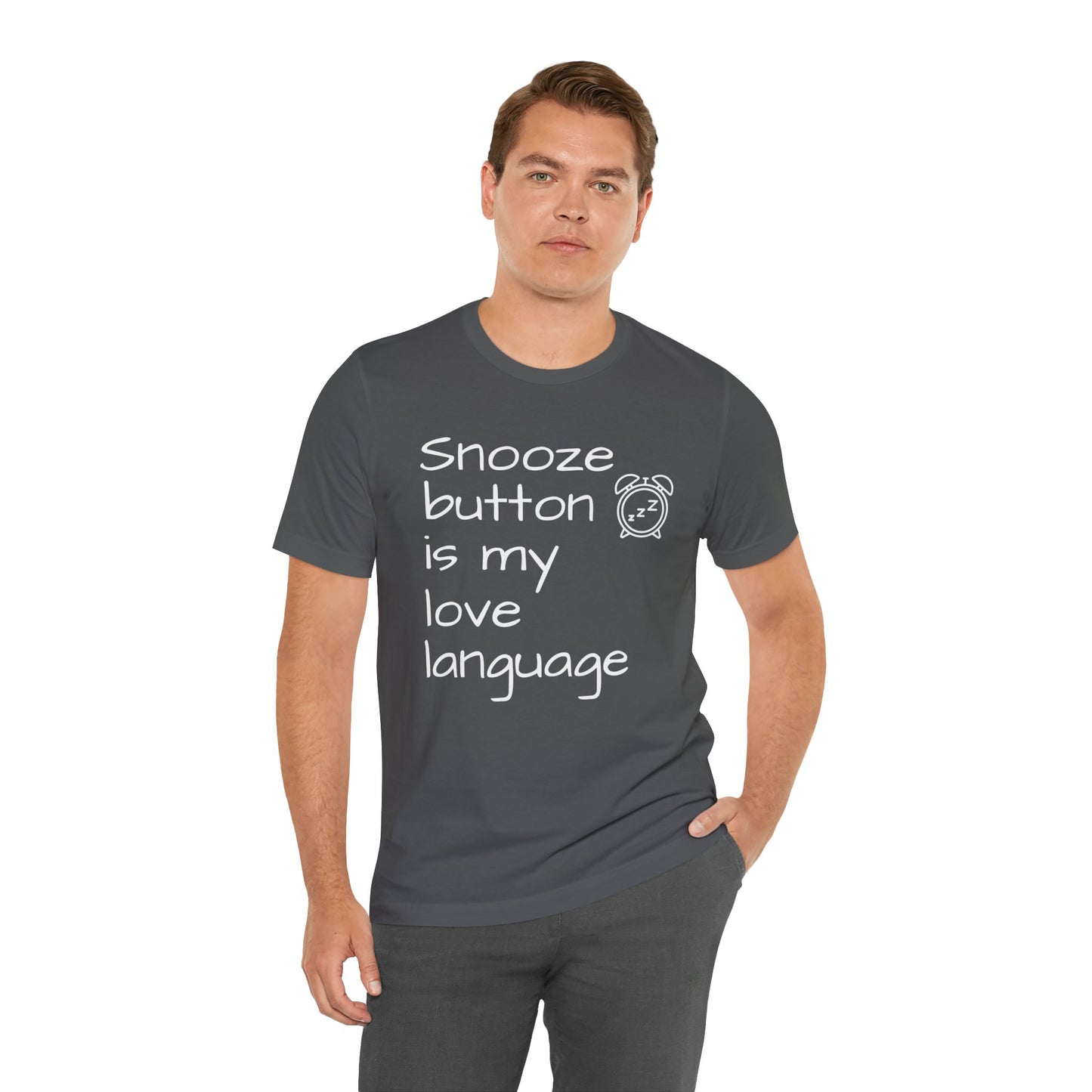 Man wearing a dark gray t-shirt with text 'Snooze button is my love language' and an icon on a white background