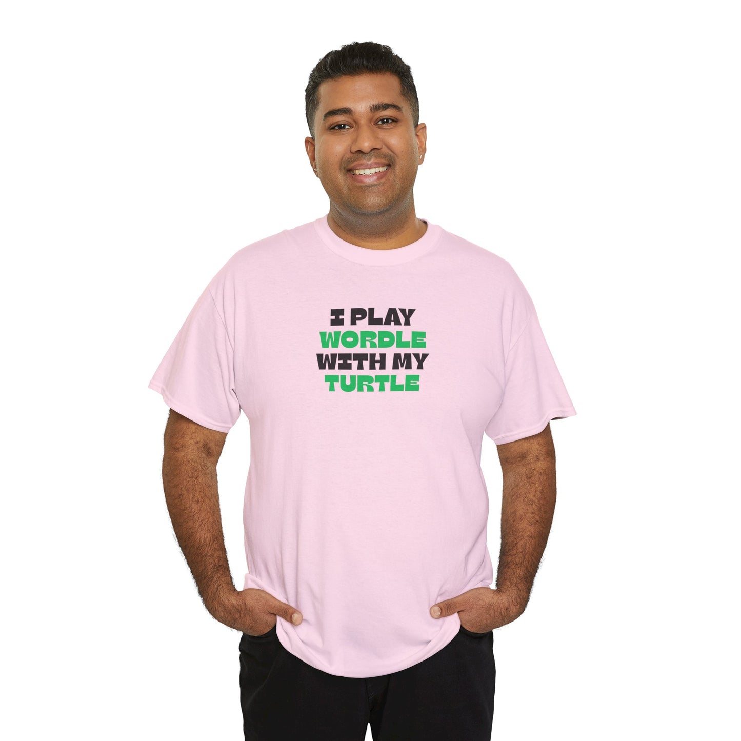 Man wearing a pink t-shirt with text 'I play wordle with my turtle' on a white background