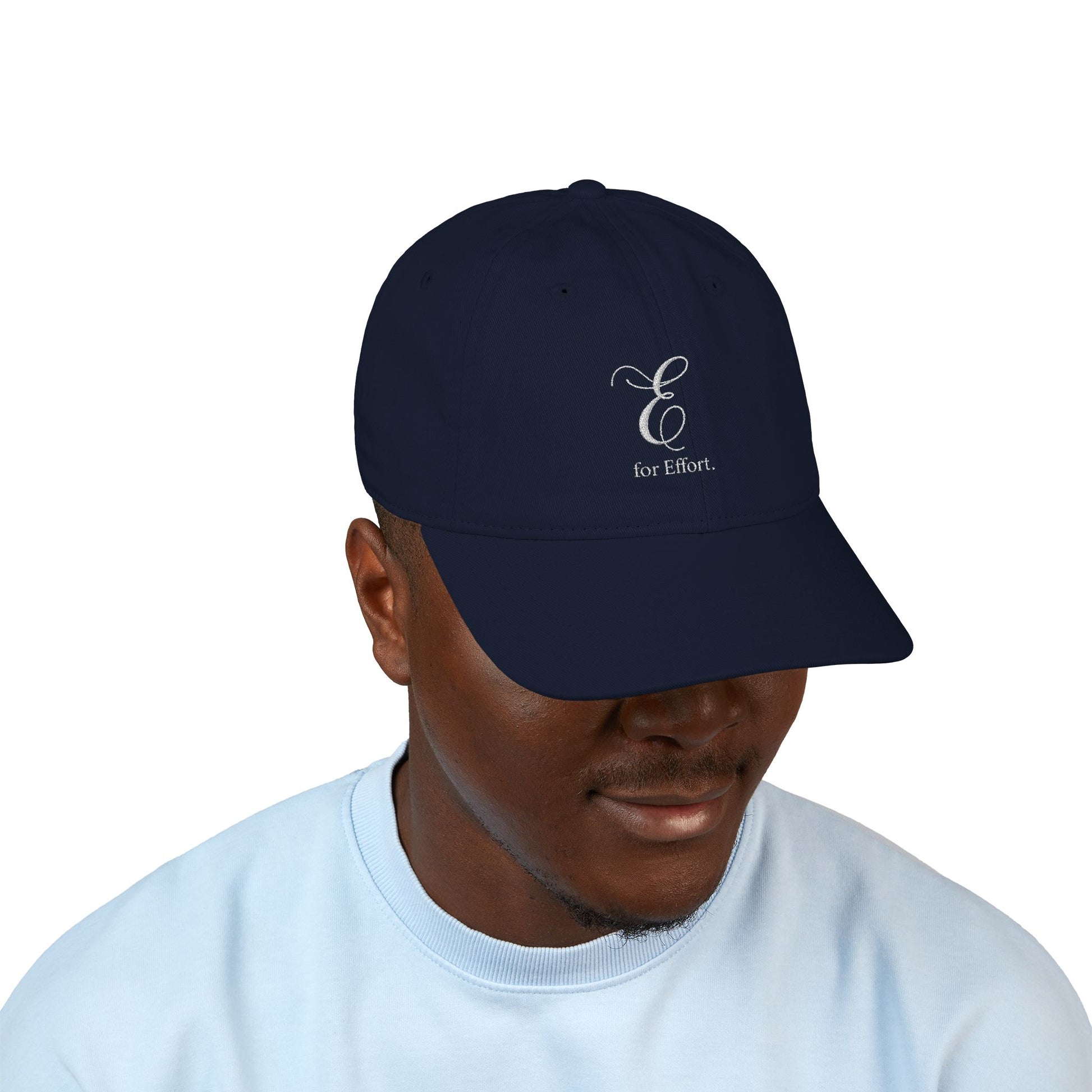 Navy blue cap with a logo and text 'E for Effort' on a white background